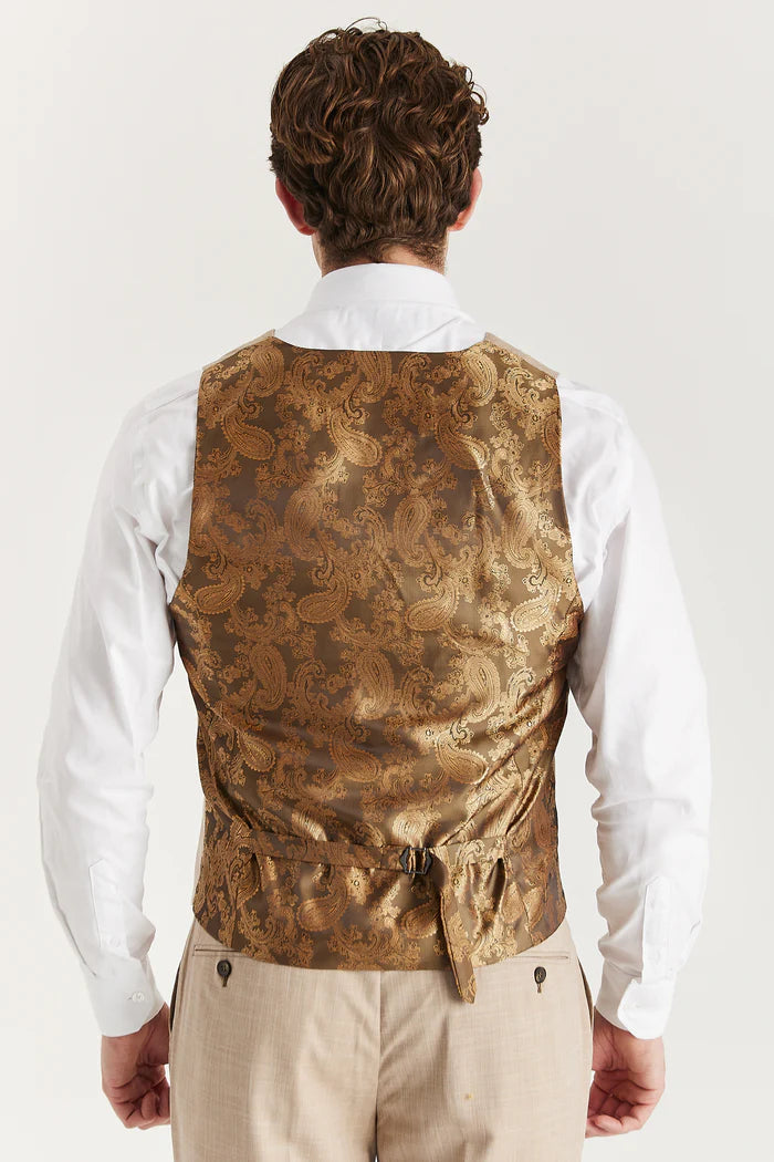 Back view of the beige waistcoat showcasing a gold paisley satin fabric with an adjustable strap.