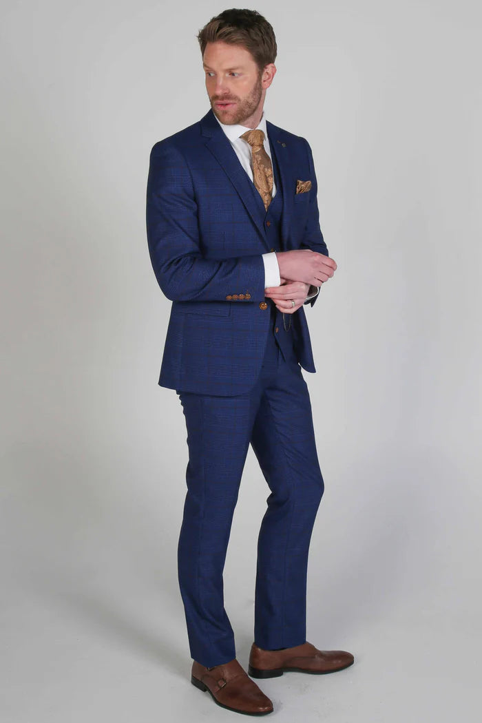 Full length front view of the Alex navy check three piece suit showing tailored fit and brown monk strap shoes
