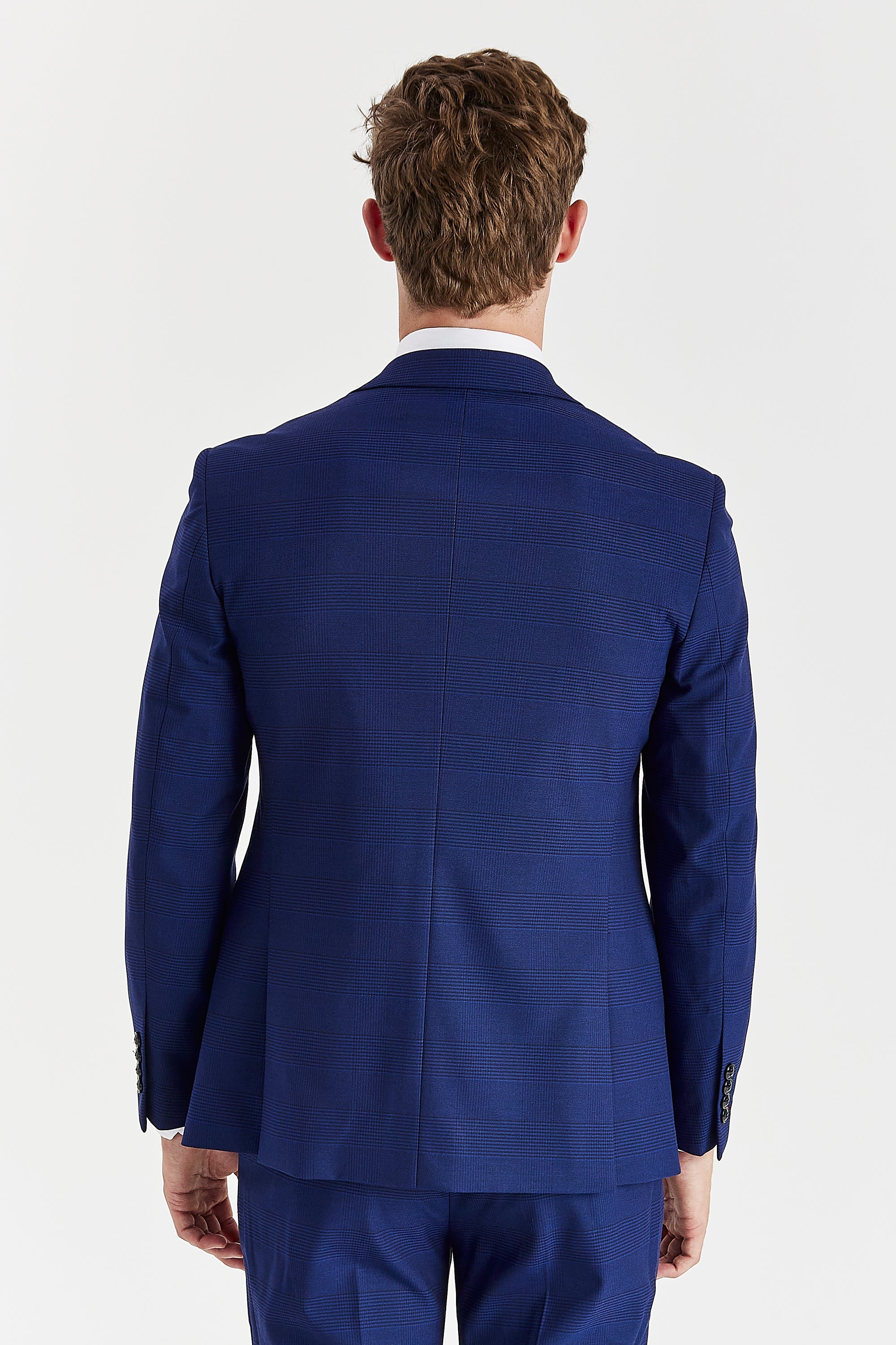 Rear view of the blue check blazer with a vent less back and central back seam.