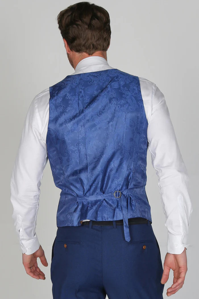 Rear view of the blue waistcoat with satin paisley back panel and adjustable buckle, worn over a white shirt.
