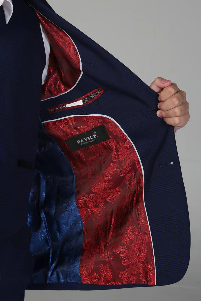 Close-up of red paisley and blue lining inside a navy boy's suit jacket showing device brand label.