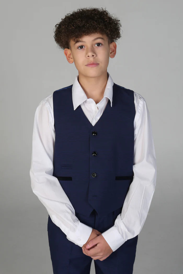 Boy in navy waistcoat with black buttons over white shirt, part of a formal three-piece suit.