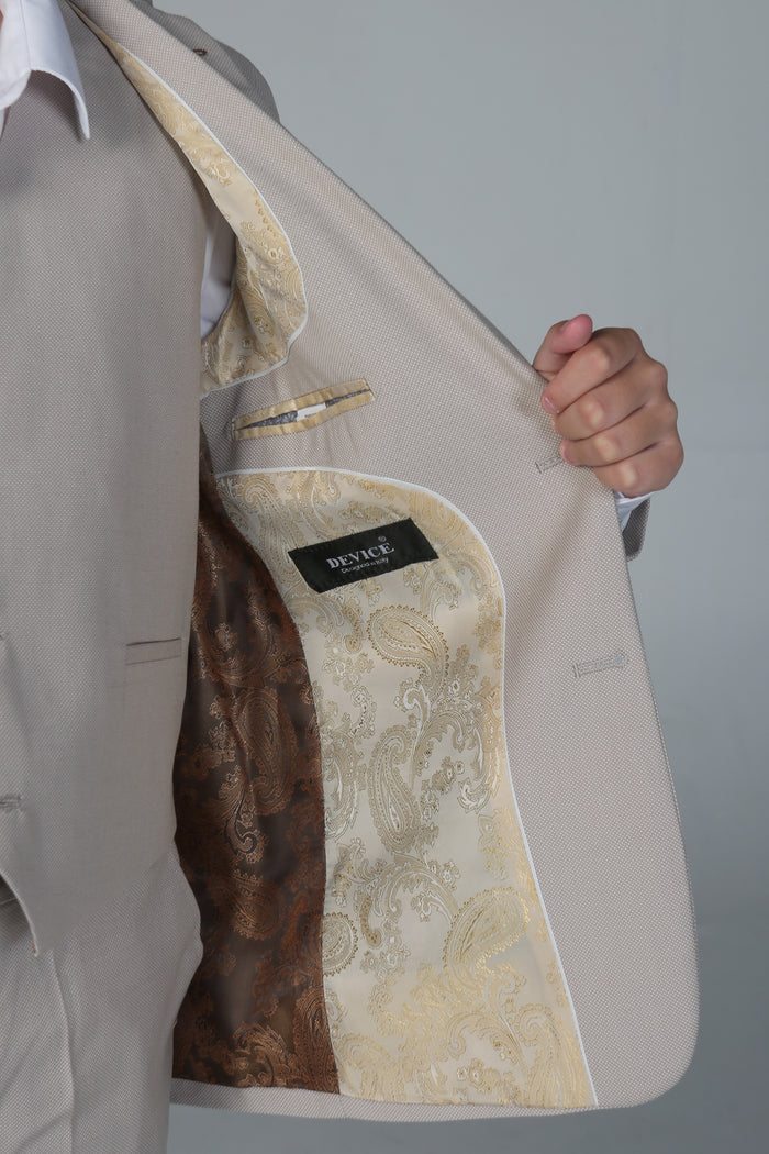 Interior view of boy's suit jacket with luxurious paisley gold and brown satin lining.