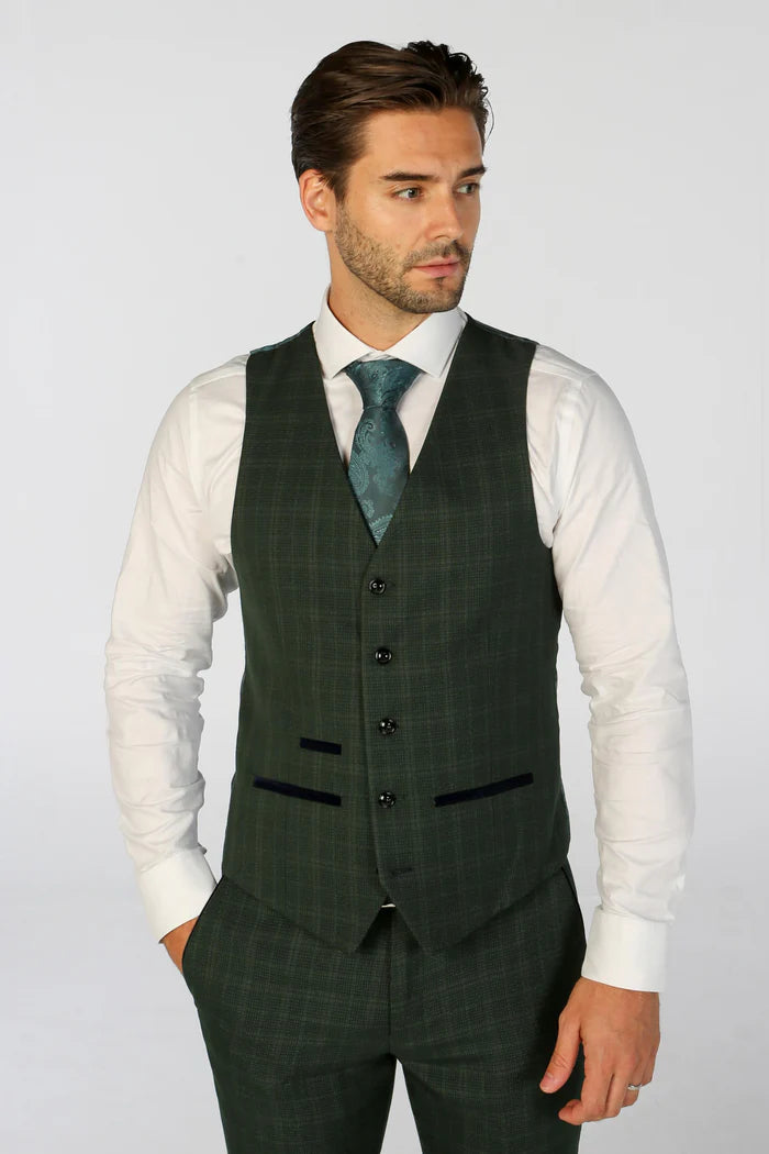 Front-facing shot of a man wearing a green check waistcoat with dark trim, paired with a white shirt and tie.