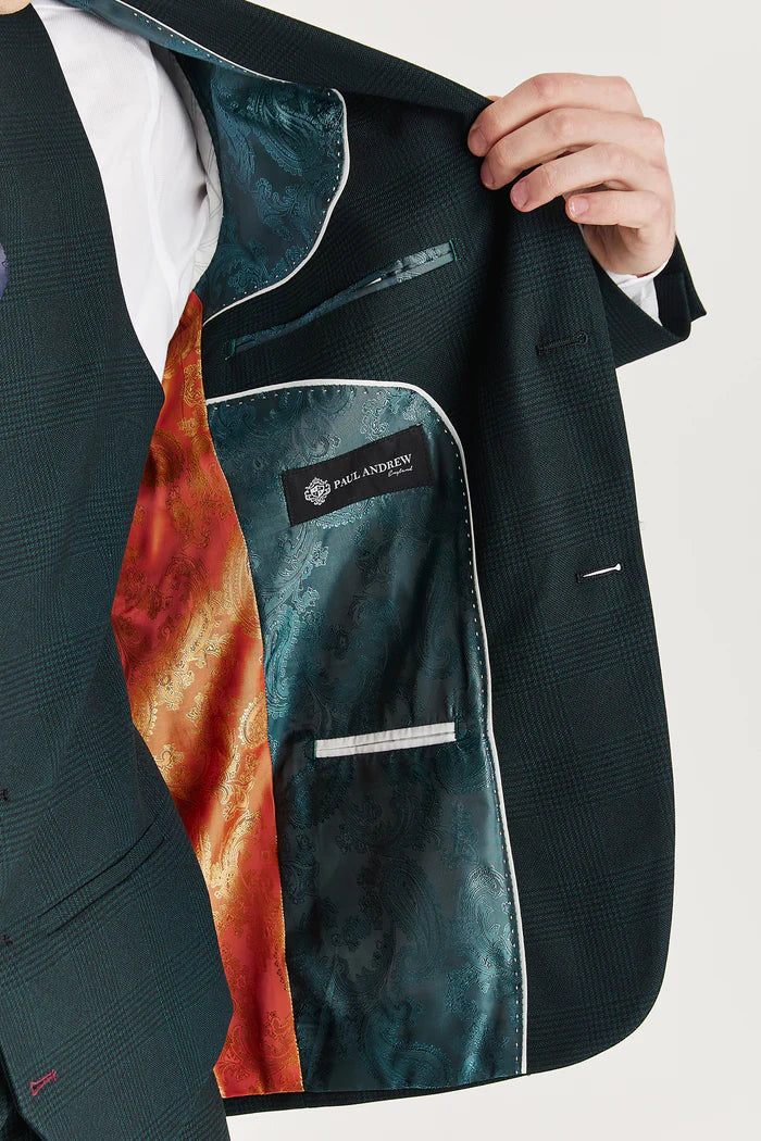 Inside view of the green suit jacket showing orange and teal paisley lining and Paul Andrew branding.