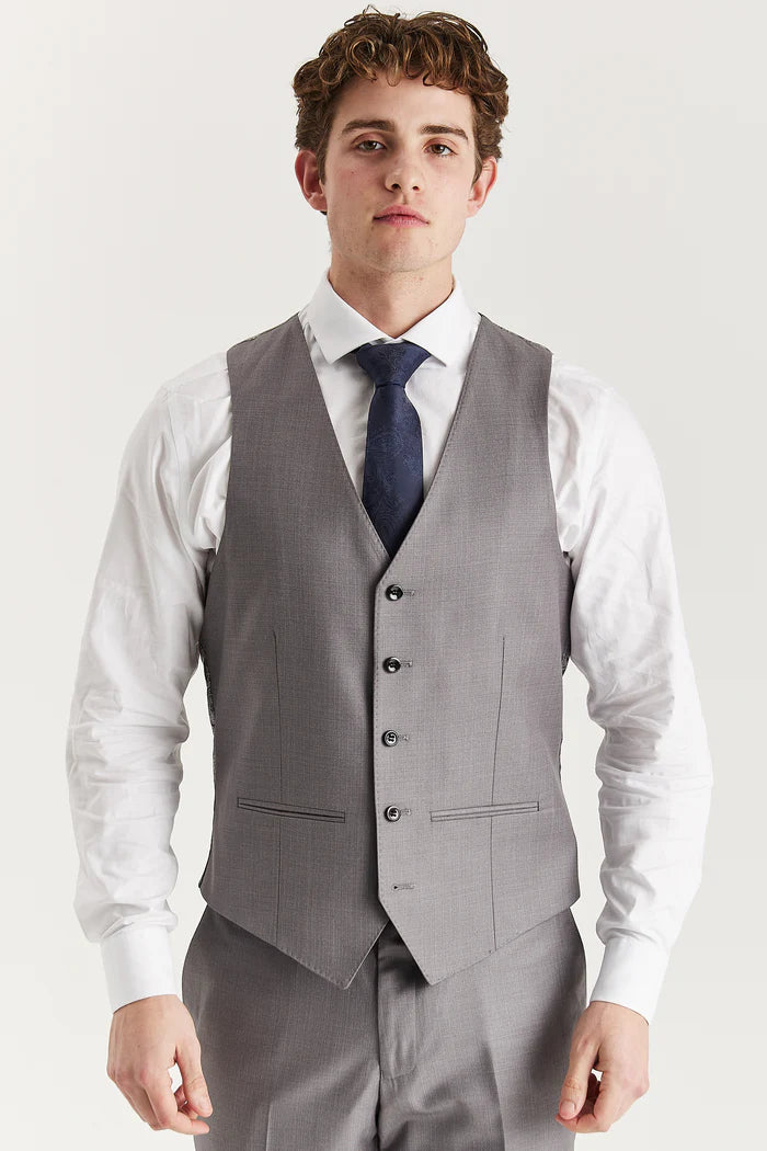 Front view of the grey waistcoat worn with a white shirt and navy tie, showing five-button fastening.