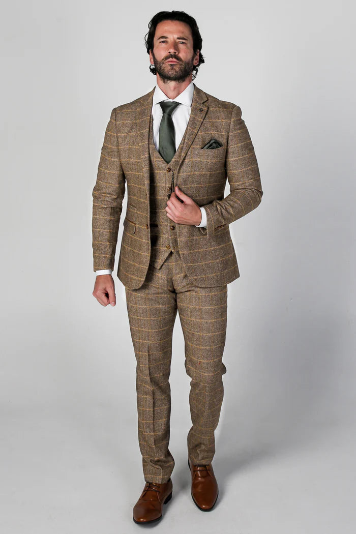 Full-body view of the Harris Brown Tweed Check Three-Piece Suit with a tailored fit and checkered pattern, paired with brown shoes and a green pocket square.