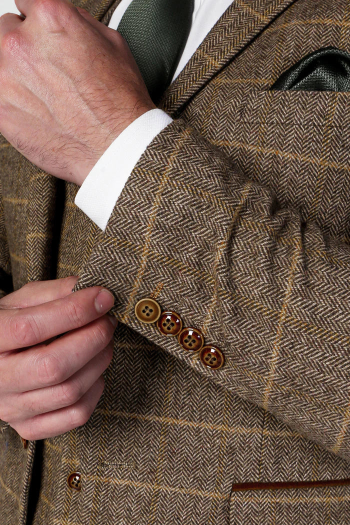 Close-up of the Harris Brown Tweed Check Suit sleeve, highlighting the brown button details and herringbone fabric design.