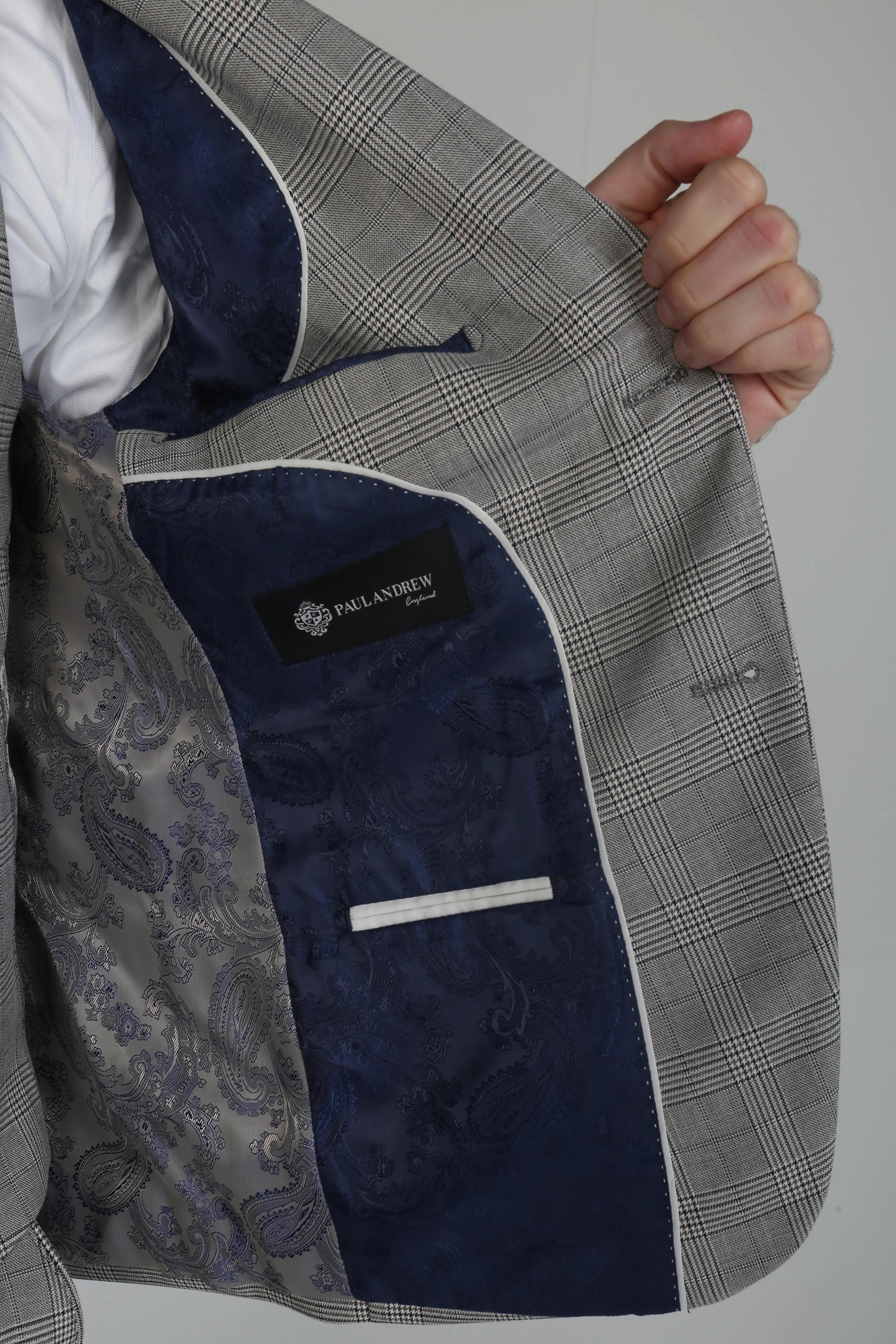 Inside view of a Hugo grey checkered suit jacket showing the blue paisley lining.