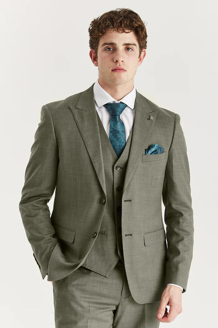 A model wearing the Kurt Sage three piece suit from Paul Andrew in a close-up front view.