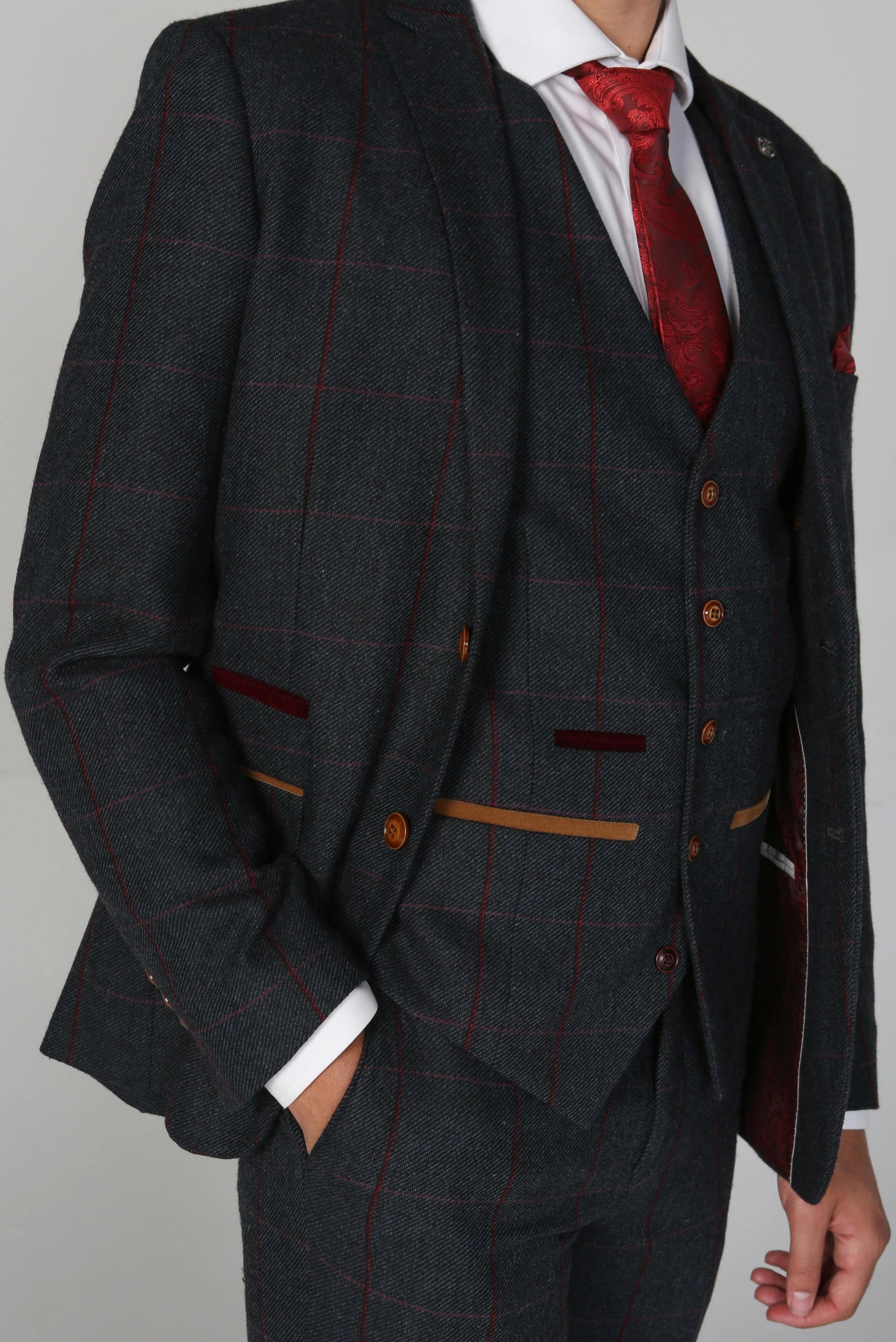 Detail of the Madrid Men's Navy Tweed Checkered Three Piece Suit pocket square and lapel, featuring a red patterned accessory.