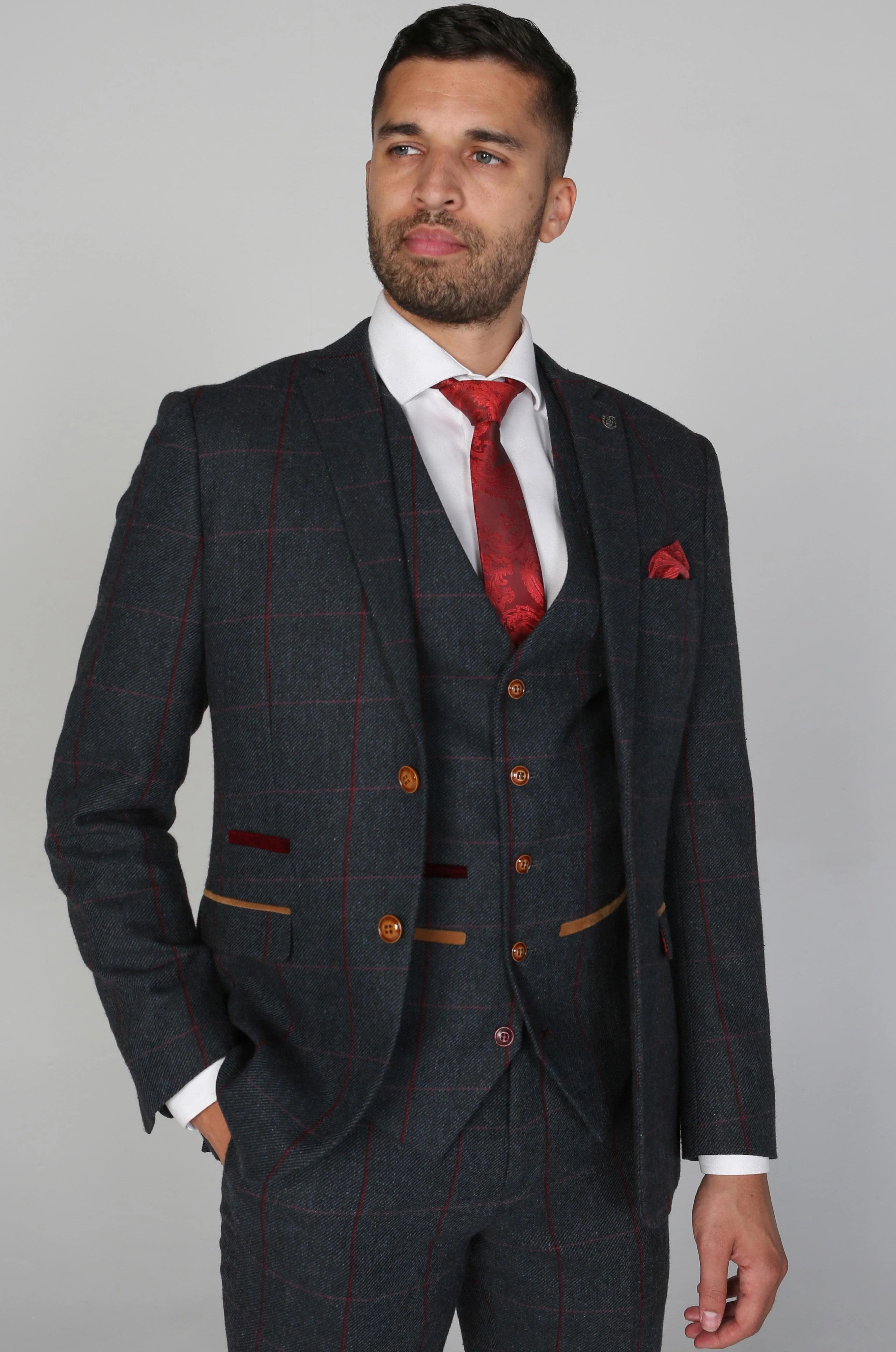 Close-up of the Madrid Men's Navy Tweed Checkered Three Piece Suit focusing on the jacket showing the buttons and red tie and pocket square