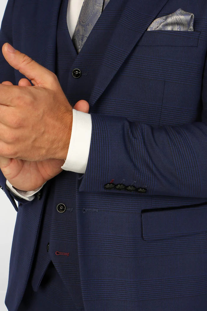 Close-up showing blazer sleeve buttons and pocket flap on the Mark blue check suit with fine textured fabric.