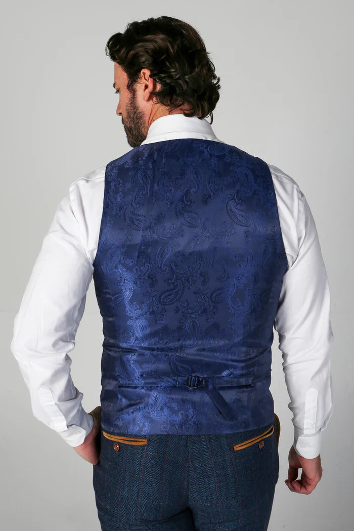 Rear shot of the waistcoat displaying rich blue paisley satin back and adjustable strap for a tailored fit.