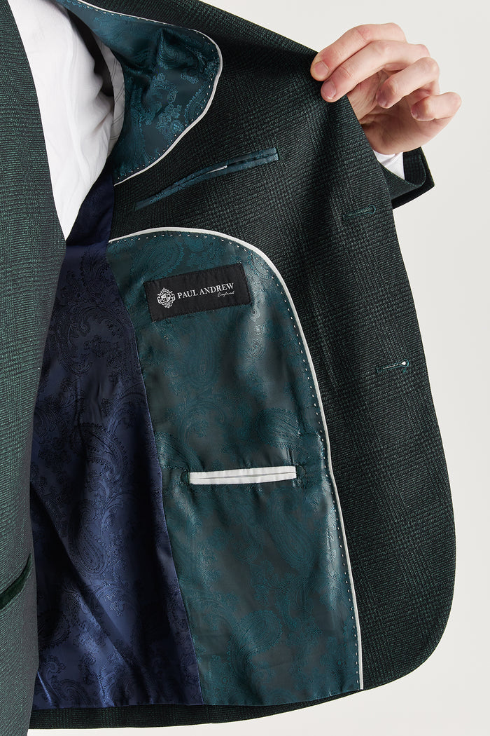 Inside view of the suit jacket showing green paisley satin lining and Paul Andrew branding.
