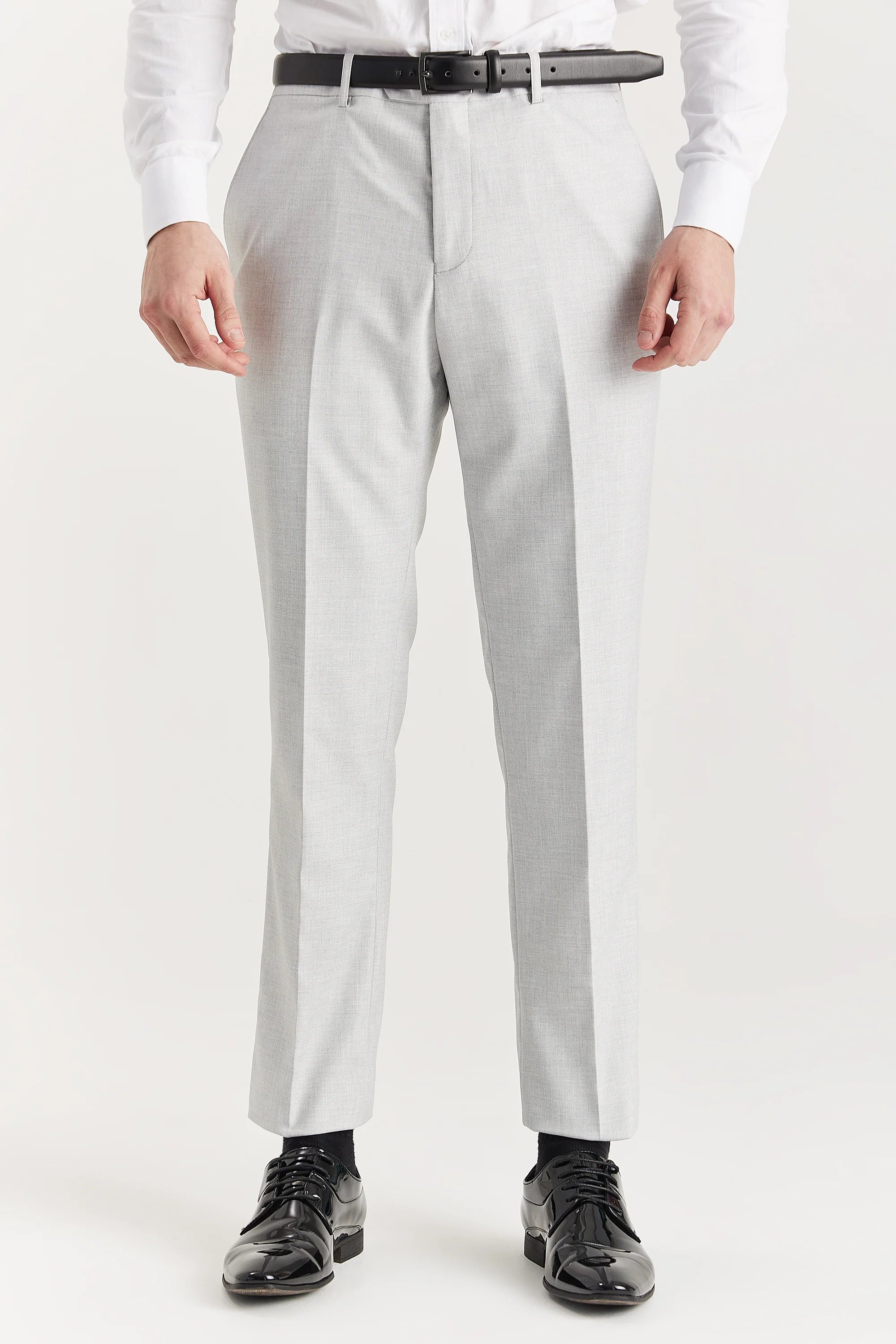 Men’s silver trousers shown from the front, worn with a white shirt and black belt and formal shoes.