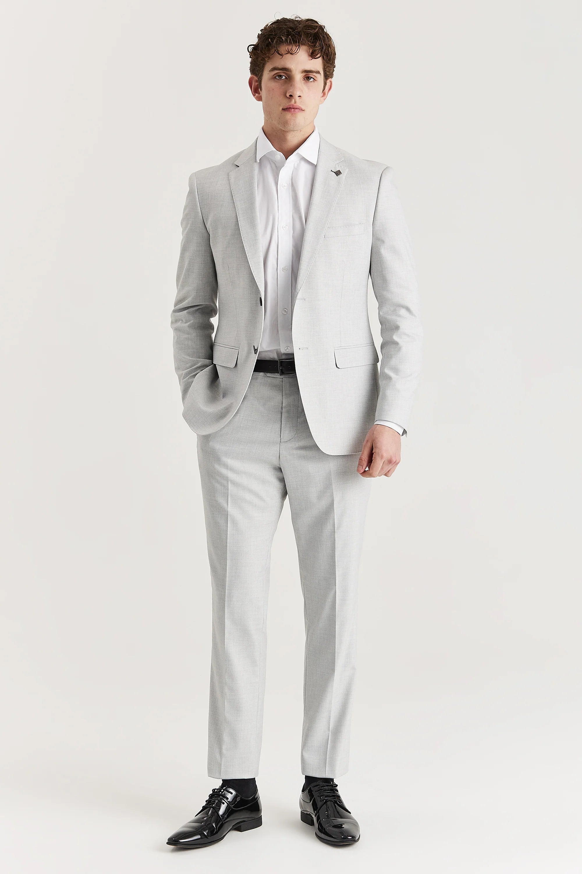 Men’s silver trousers shown as part of a full outfit with the matching blazer and a white shirt.