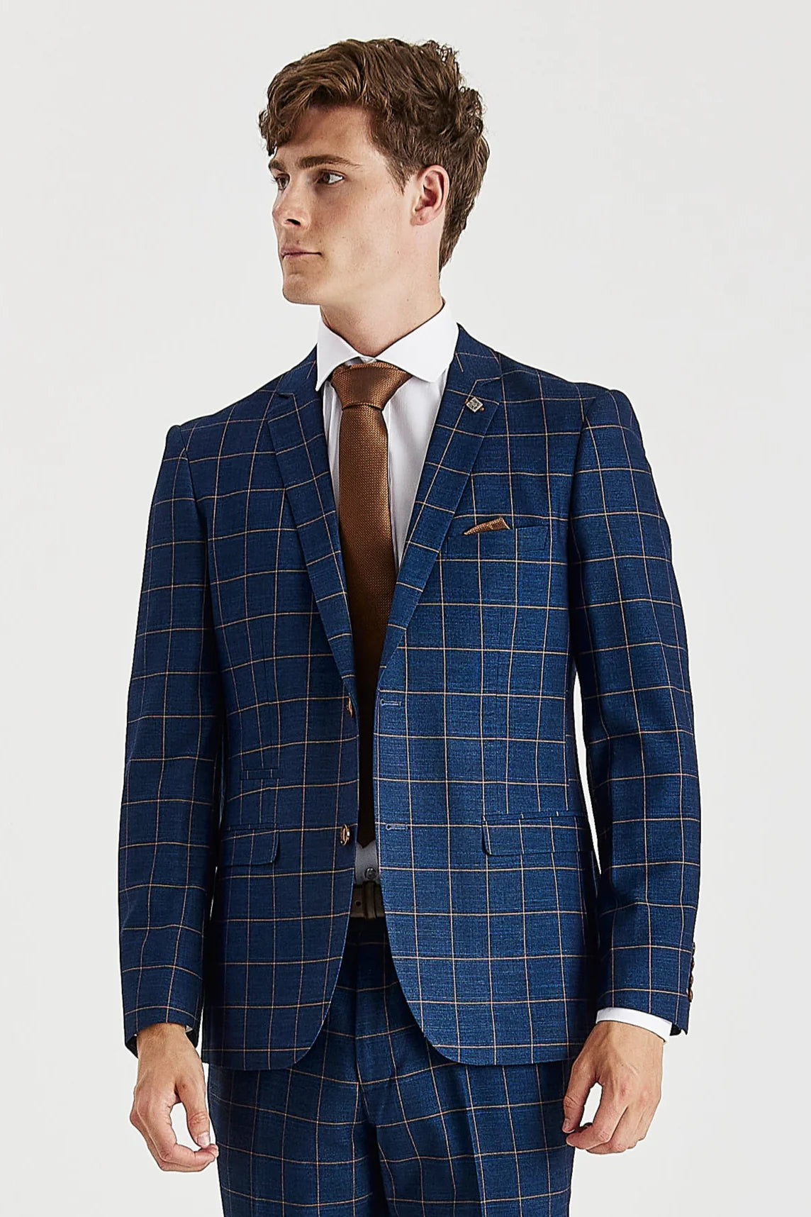 Knee-up front view of a single-breasted navy suit jacket with brown windowpane checks , detailed with contrasting brown buttons, a white shirt, a brown tie, and a matching pocket square.