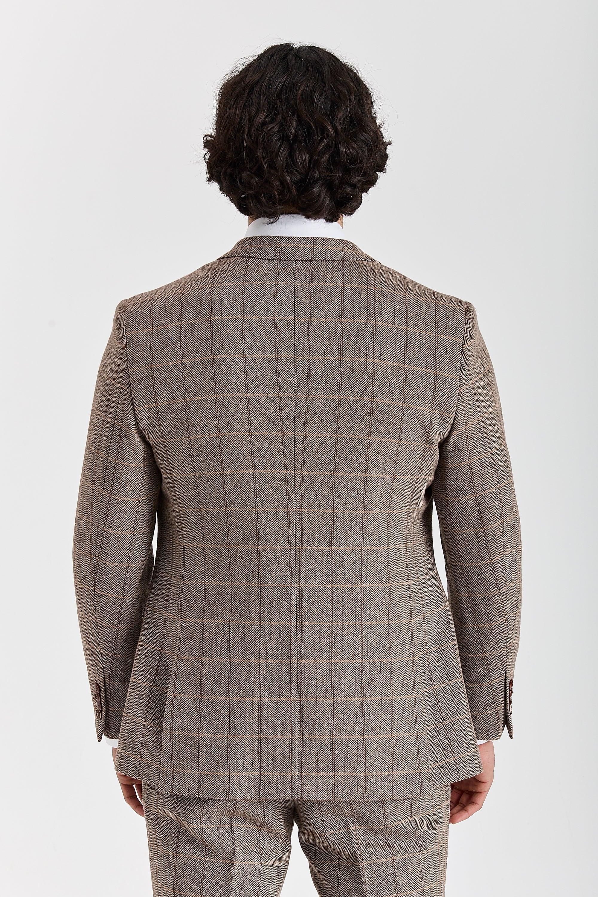 Back view of a Harris brown herringbone tweed check suit jacket with matching trousers and brown sleeve buttons.