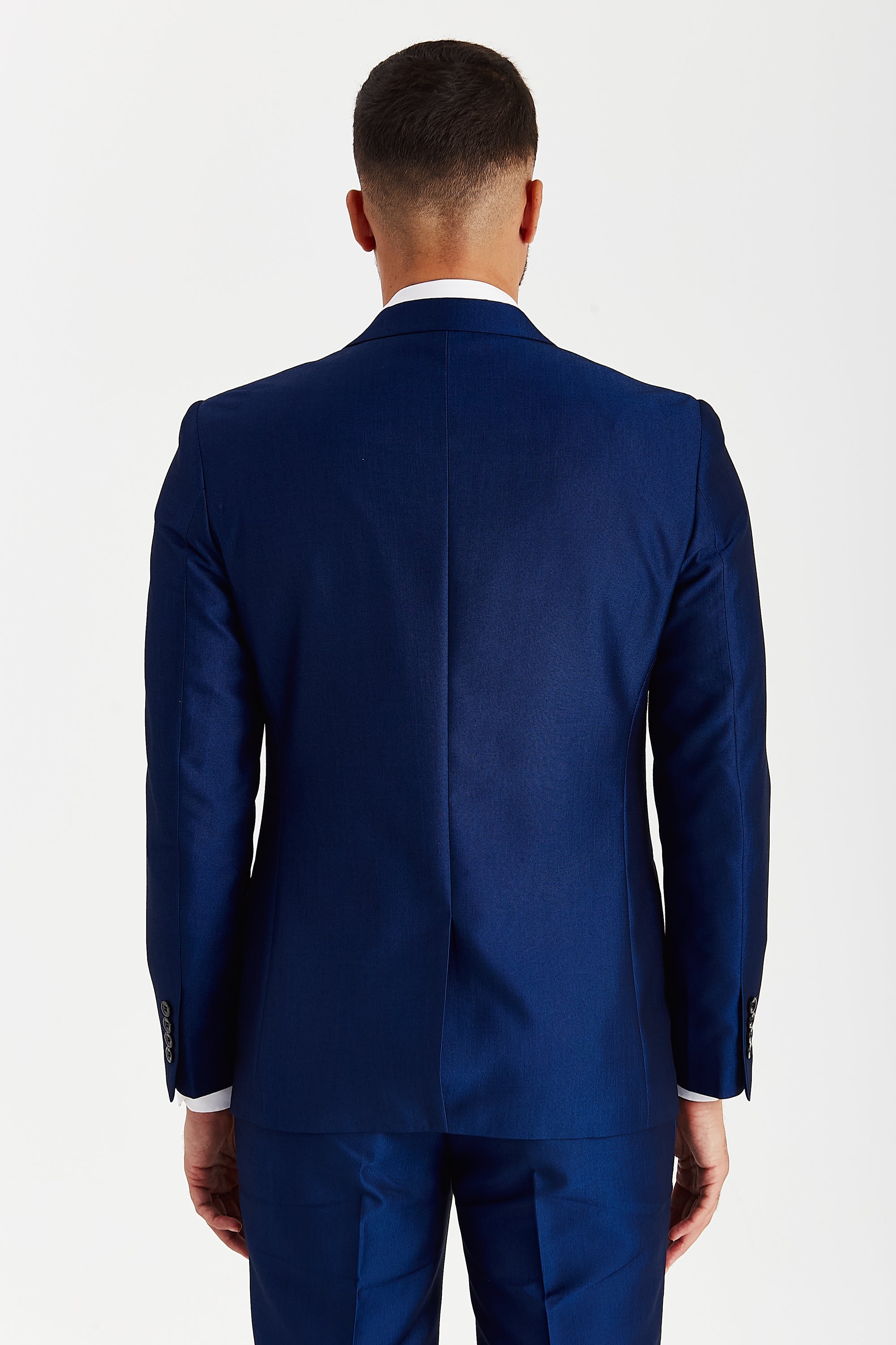 Back view of a blue suit jacket with matching trousers.