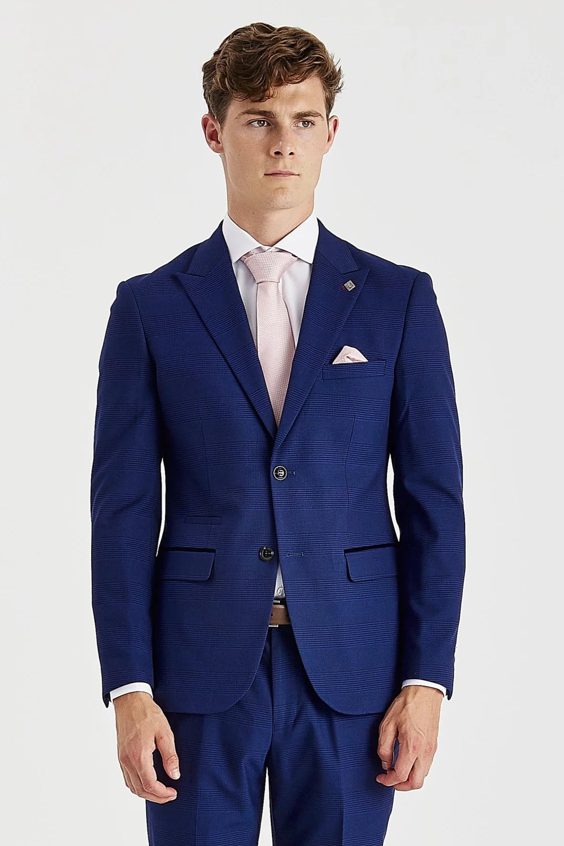 Front blazer view of blue glen check suit jacket worn with a white shirt, light pink tie and pocket square