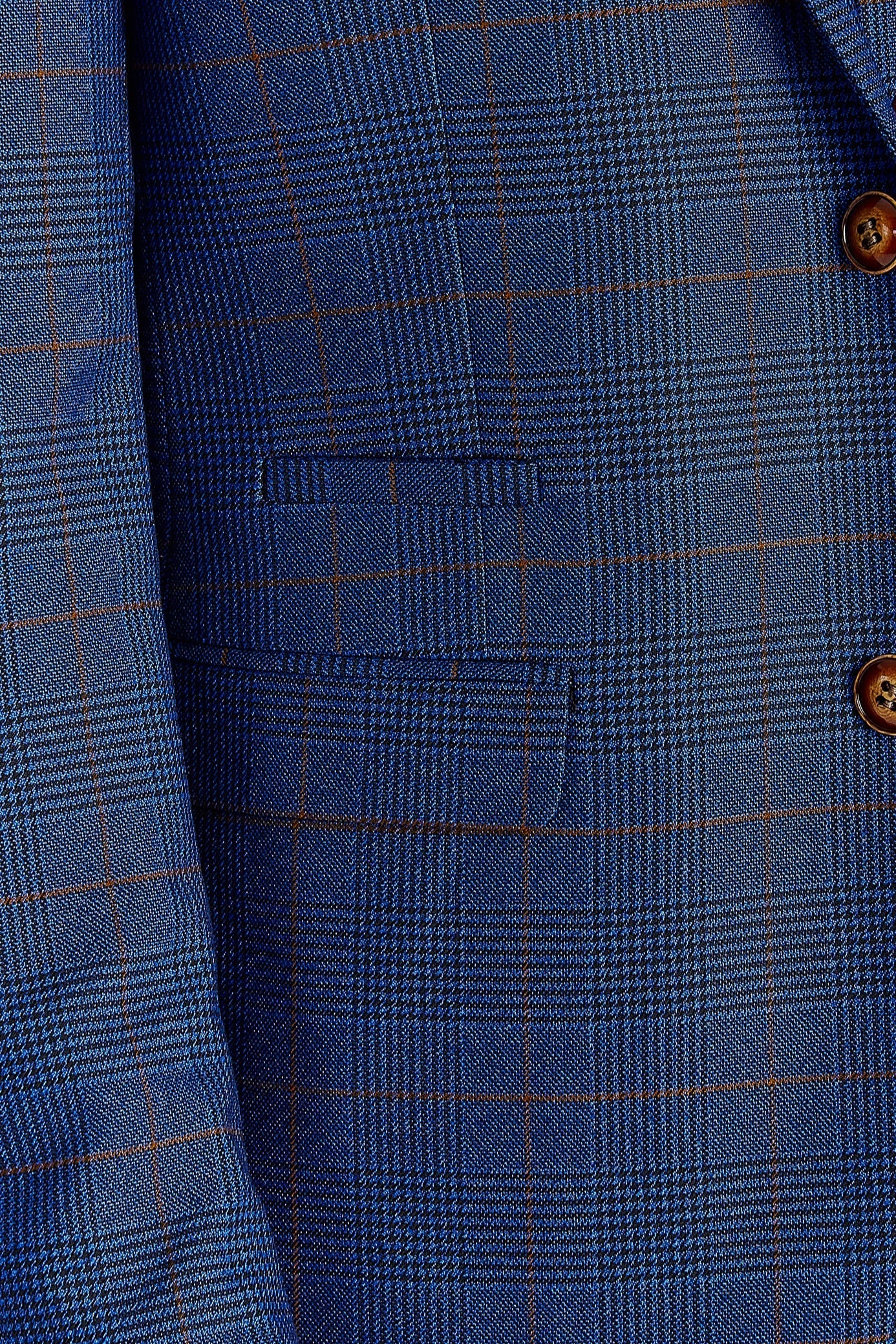 Close-up view of the navy burgundy check blazer showing brown buttons, front pockets, burgundy check lines and the textured woven pattern.
