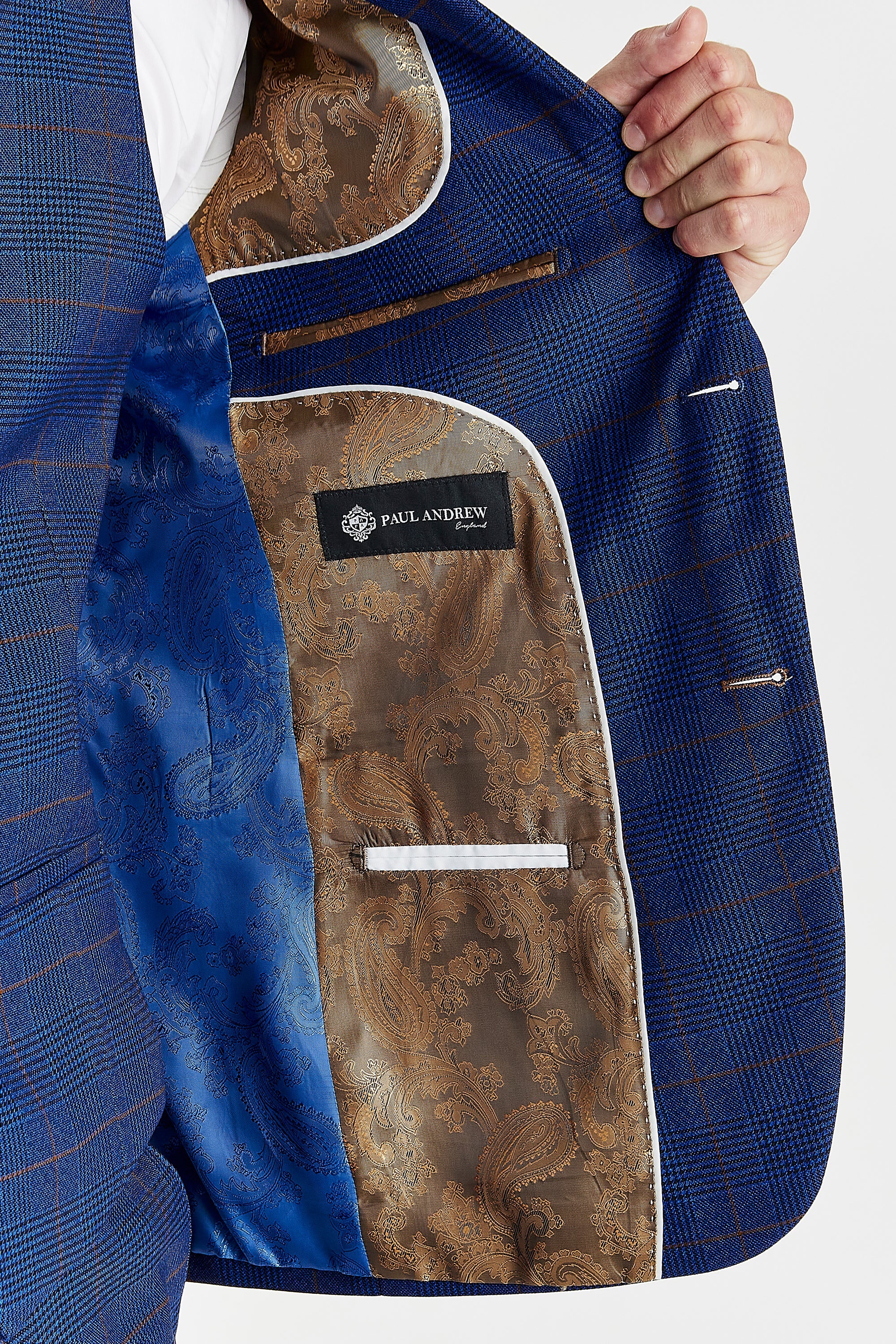 Interior view of the navy burgundy check blazer with blue and light brown paisley lining and a visible Paul Andrew logo label.