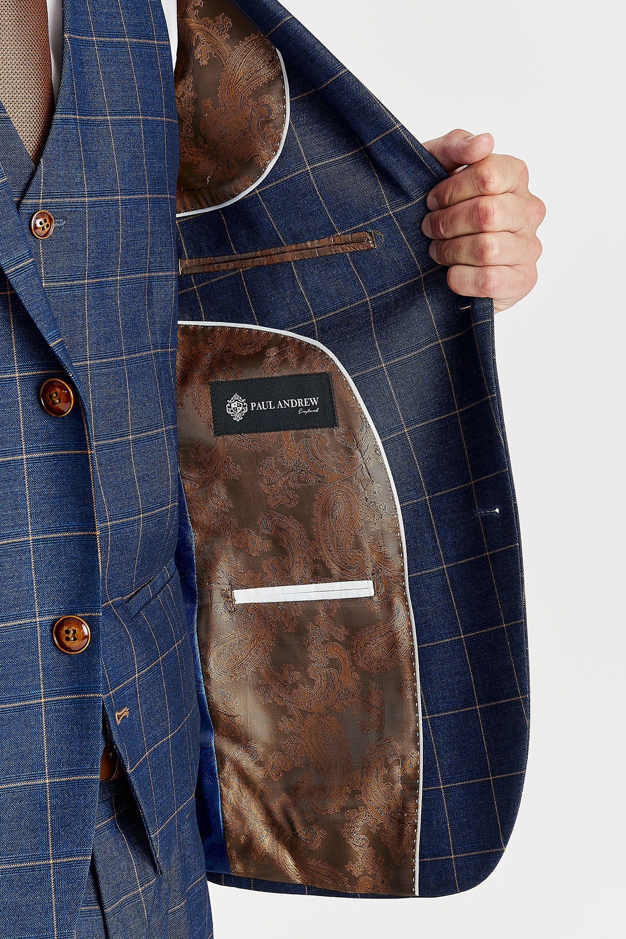 Interior view of the navy check blazer with blue and brown paisley lining and a visible Paul Andrew logo label.