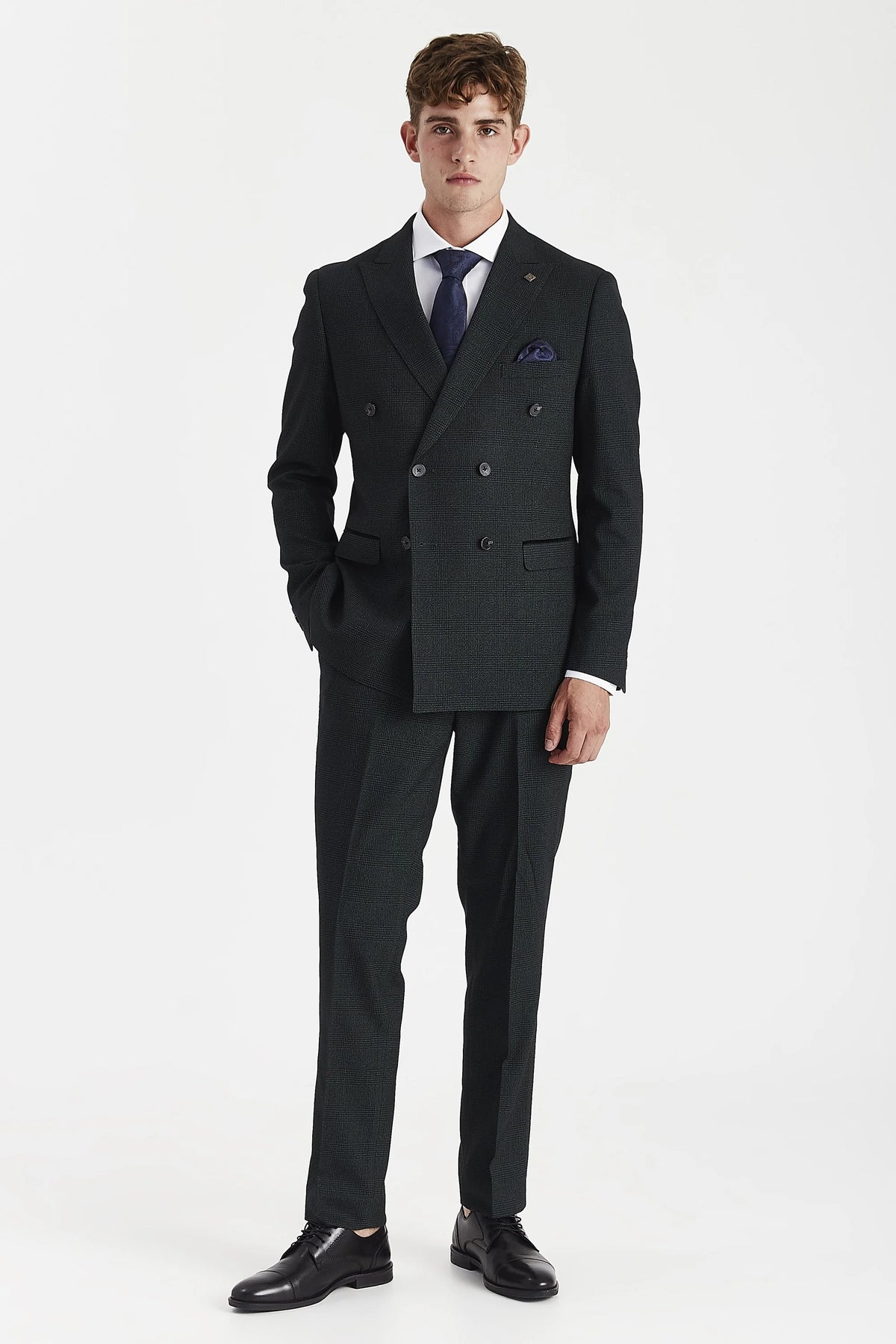 Full-length front view of the olive check suit, showing the fitted jacket and matching trousers tapering towards the ankles.