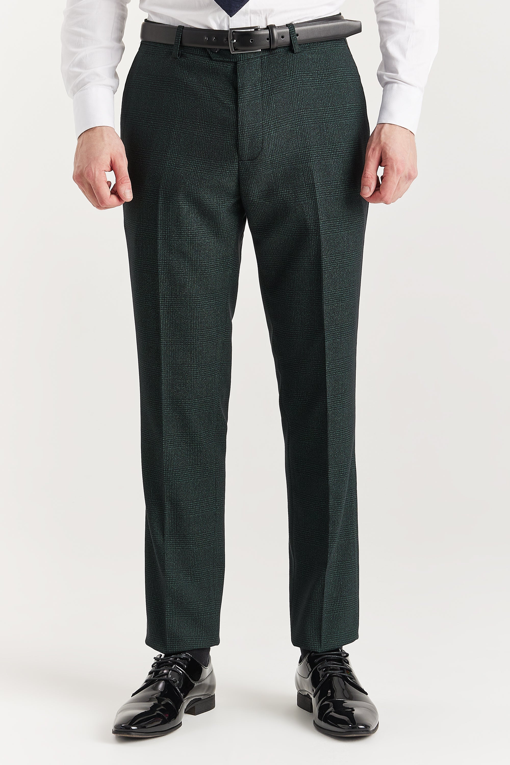 Men’s olive check trousers shown from the front, worn with a white shirt, blue tie and black formal shoes.