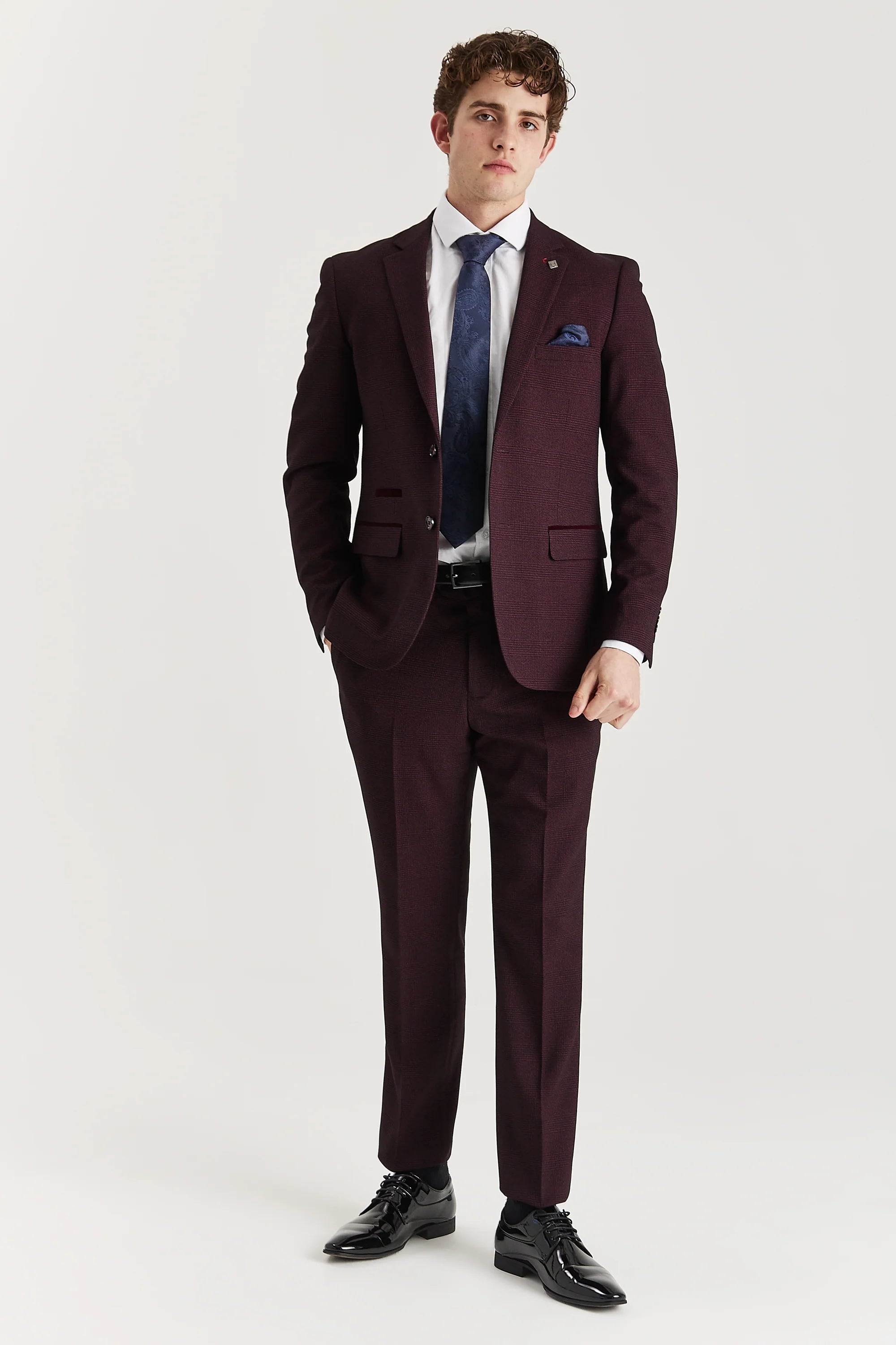 Men’s wine check trousers shown as part of a full outfit with the matching blazer, white shirt and blue tie.