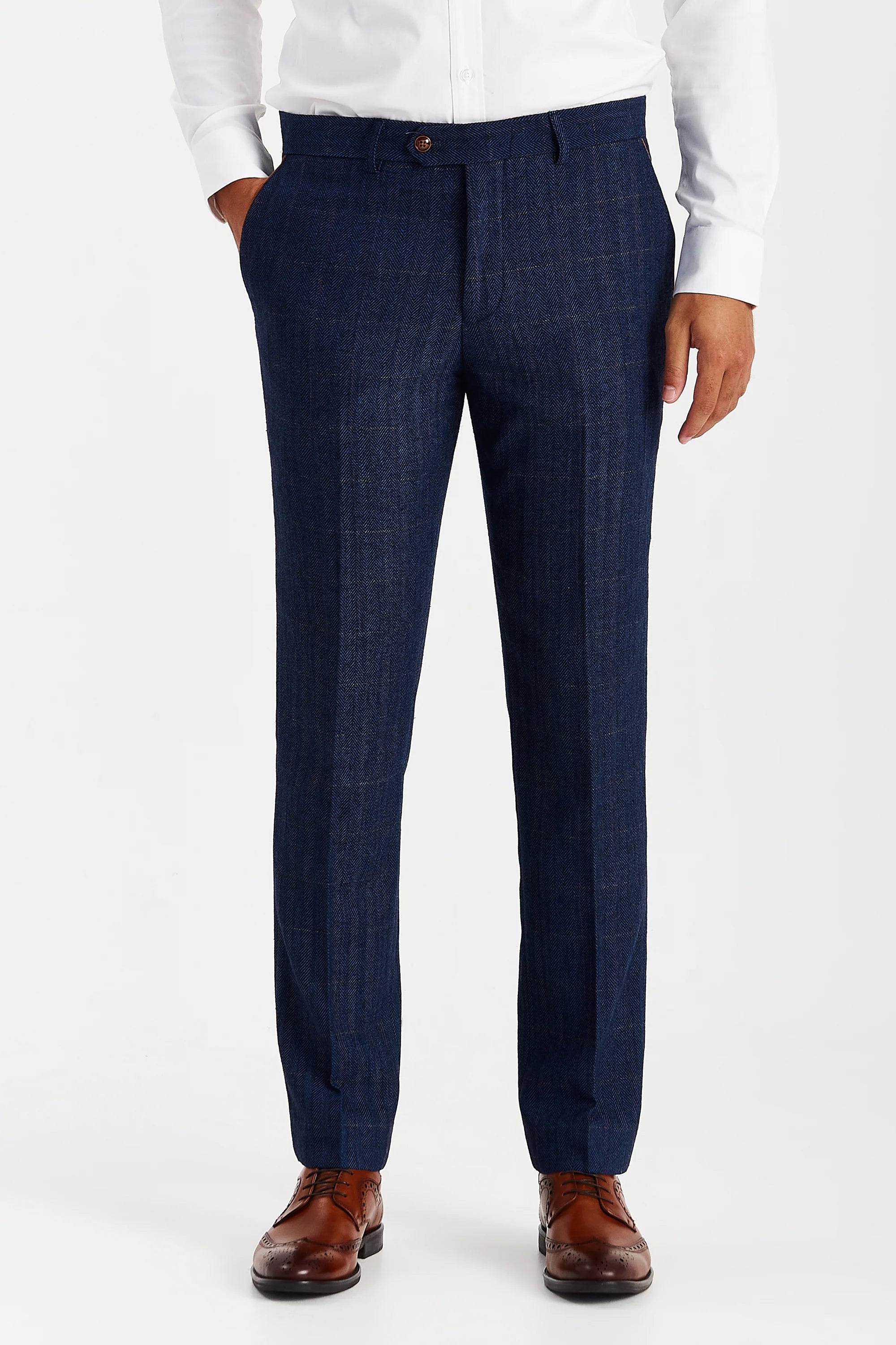 Front view of Paul Andrew Scott men's navy herringbone trousers featuring a tailored fit and a subtle windowpane check pattern, styled with a white dress shirt and brown leather brogues.