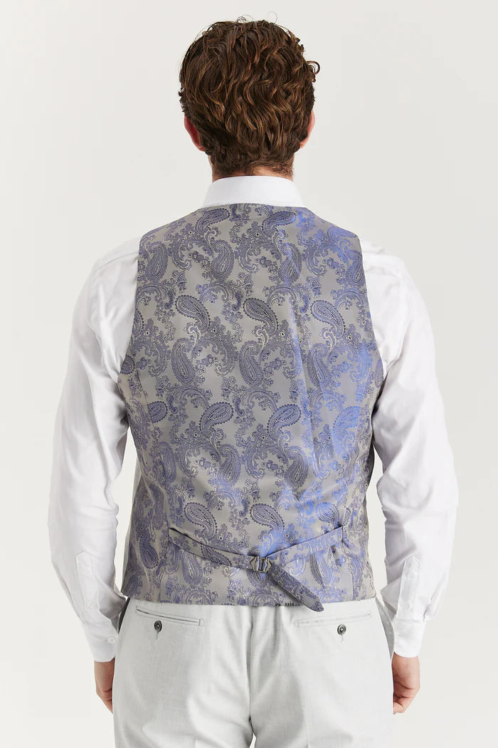 Rear view of the silver waistcoat showing adjustable strap and elegant paisley satin back in light grey and blue fabric.