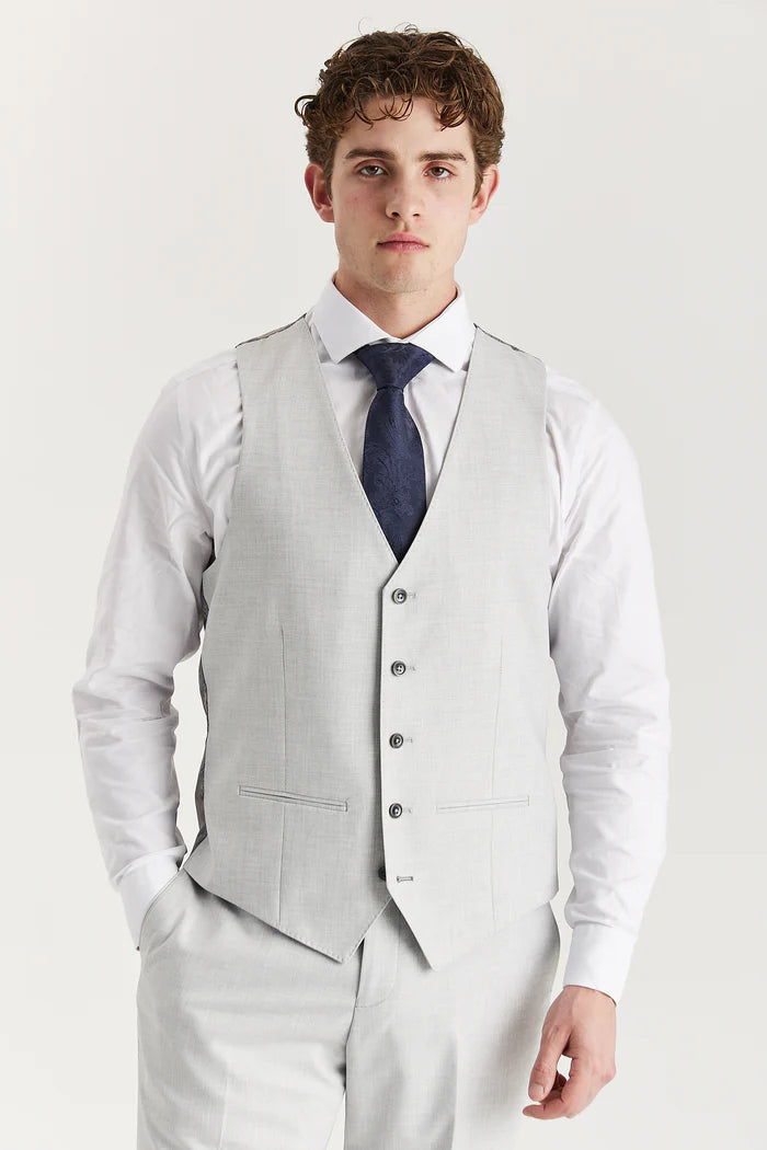 Model wearing a silver waistcoat with matching trousers and a navy tie, front view emphasizing the clean lines and button details.