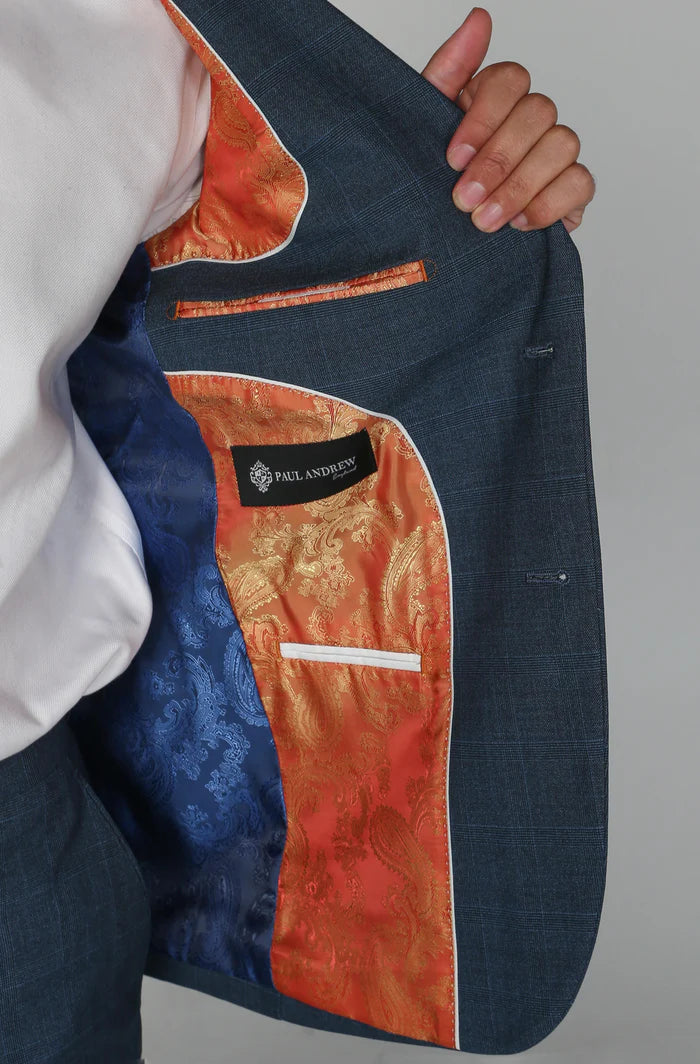 Interior of the navy blazer featuring vibrant paisley lining in orange, gold, and blue with Paul Andrew branding.