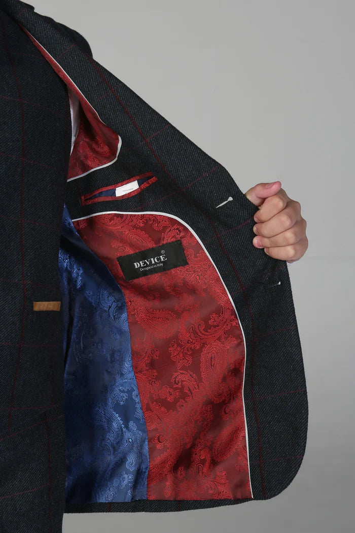 Inside view of boy’s check suit jacket featuring dual-tone satin lining in red and blue paisley design.