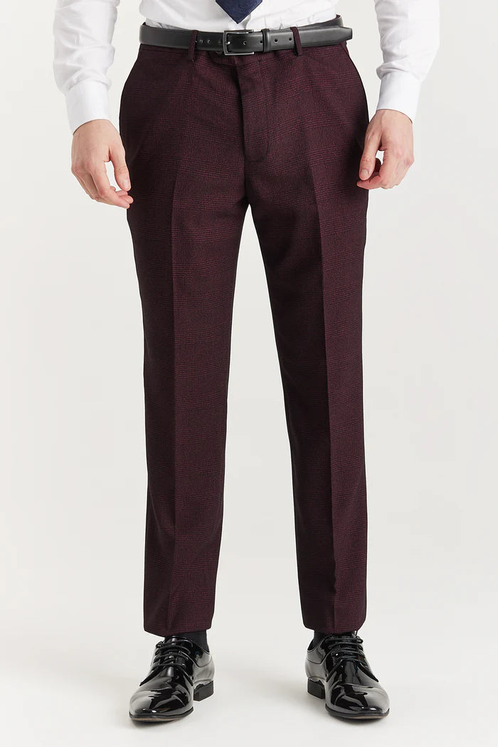 Front-facing image of burgundy check trouser, styled with a black leather belt and shiny black shoes.