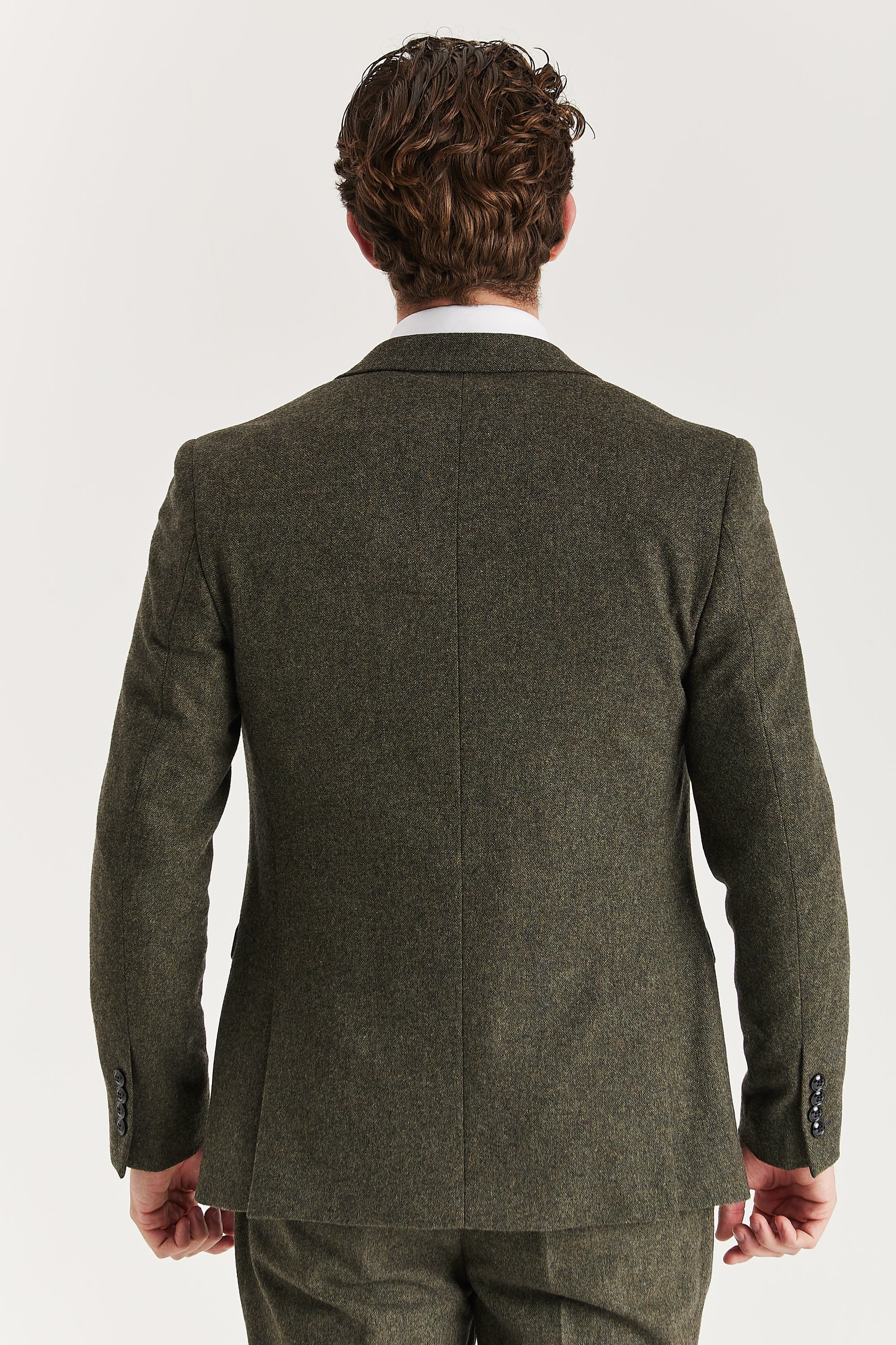 Rear view of the green tweed blazer with a vent-less back and central back seam.