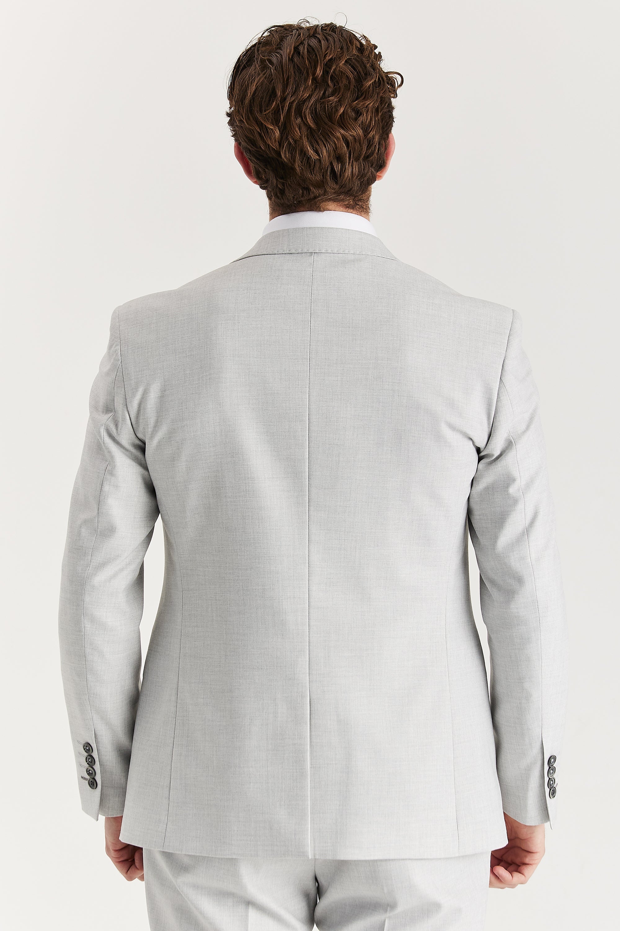 Rear view of the silver blazer and matching trousers.