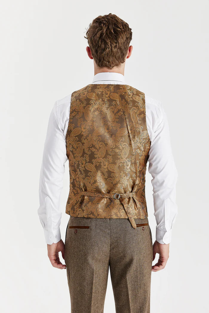 Back view of Oscar brown tweed waistcoat featuring gold paisley satin fabric and adjustable belt detail.