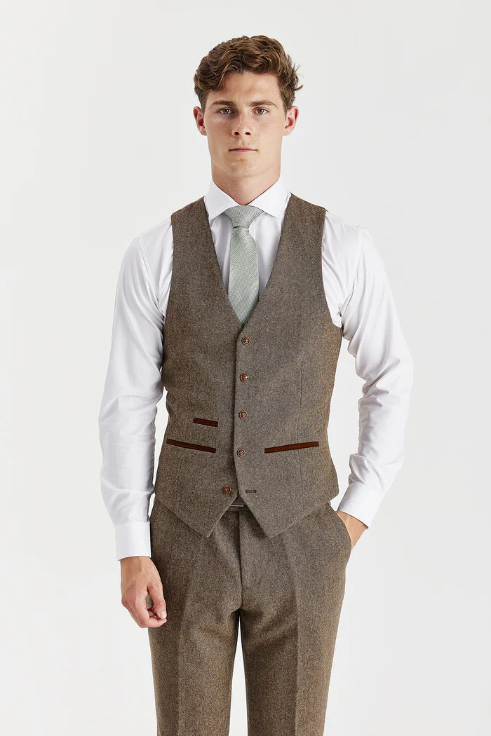  Front view of Oscar brown tweed waistcoat with brown buttons and contrasting trim, worn over white shirt and lime green tie.

