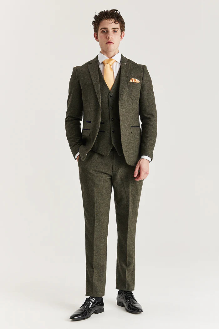 Full front view of Oscar green tweed three-piece suit with tailored trousers, waistcoat, and golden-yellow accessories for a formal look.

