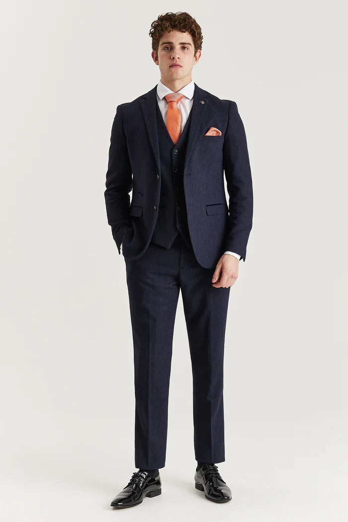 Full front view of Oscar navy tweed three-piece suit with tailored trousers, waistcoat, and orange accessories for a formal look.


