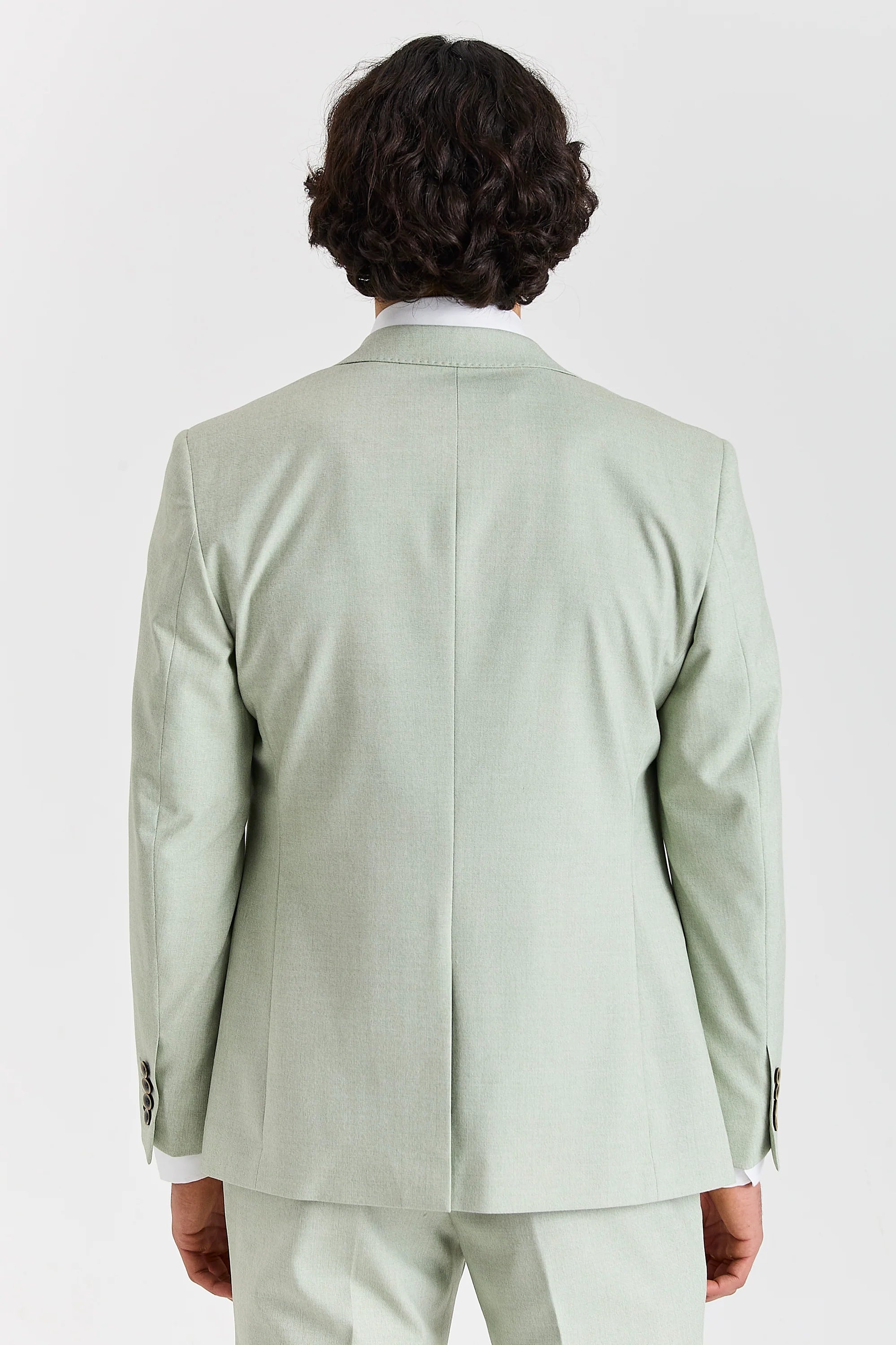 Back view of a mint green suit jacket with a plain centre seam, matching trousers and buttoned cuffs.
