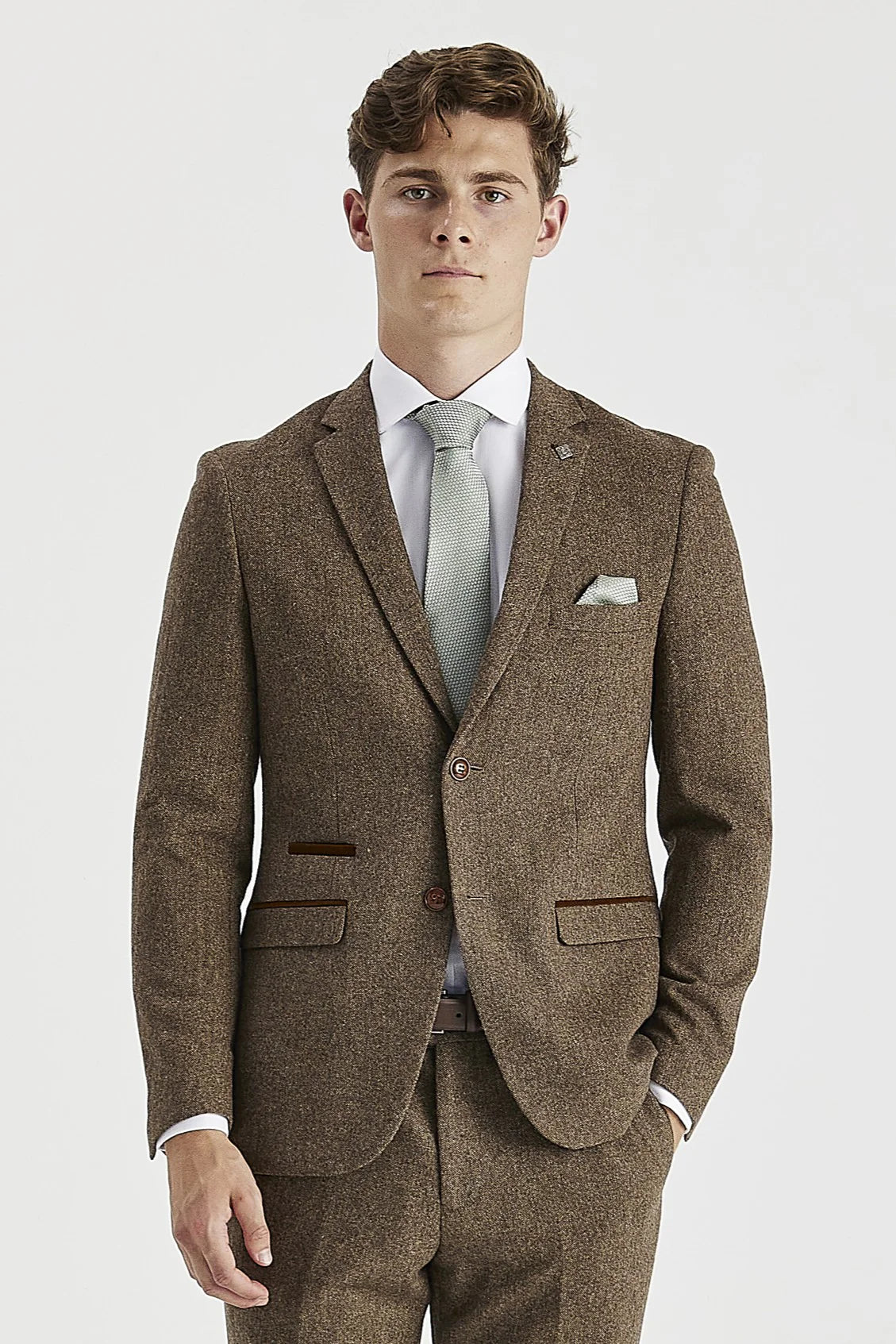 Front view of the brown tweed blazer, worn with matching trousers, a white shirt, light green tie and matching pocket square