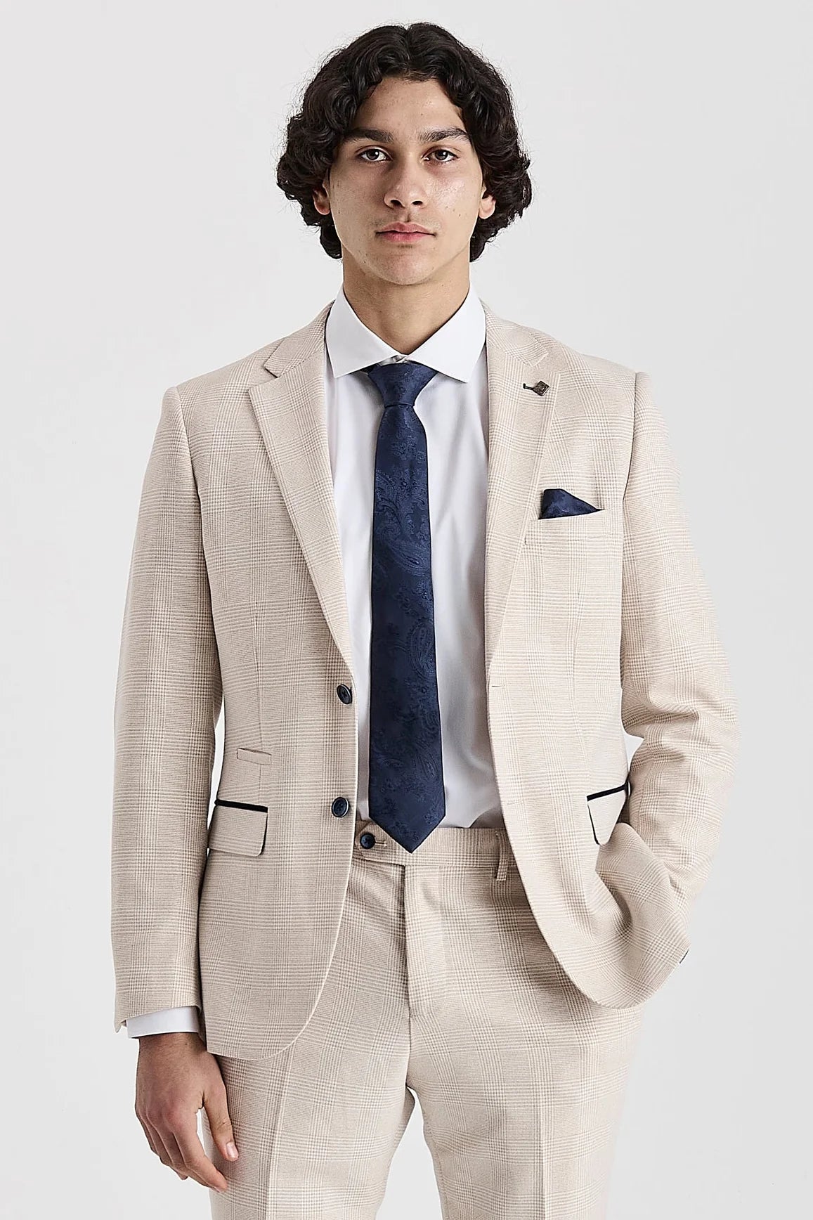 Front view of a men's cream check suit jacket and matching waistcoat, worn over a white shirt with a dark blue patterned tie and pocket square.