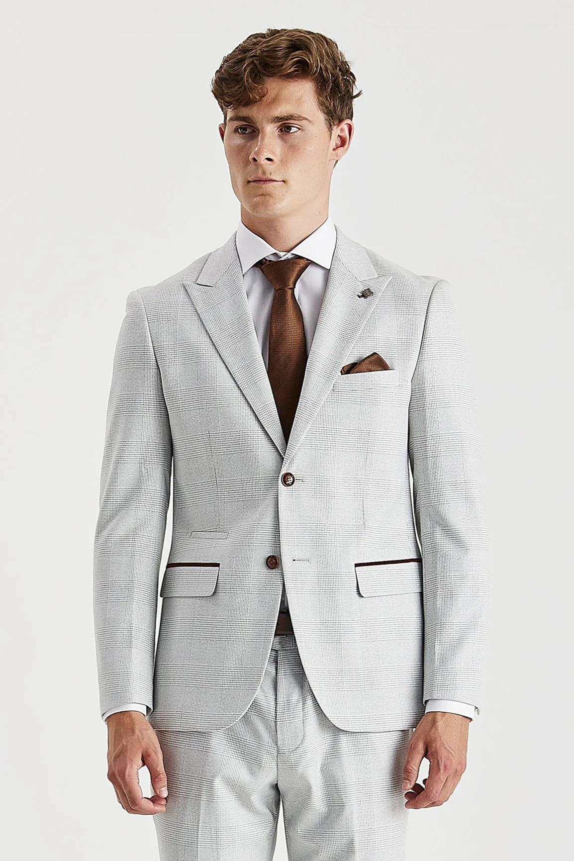 Front blazer view of stone glen check suit jacket worn with a white shirt, brown tie and pocket square