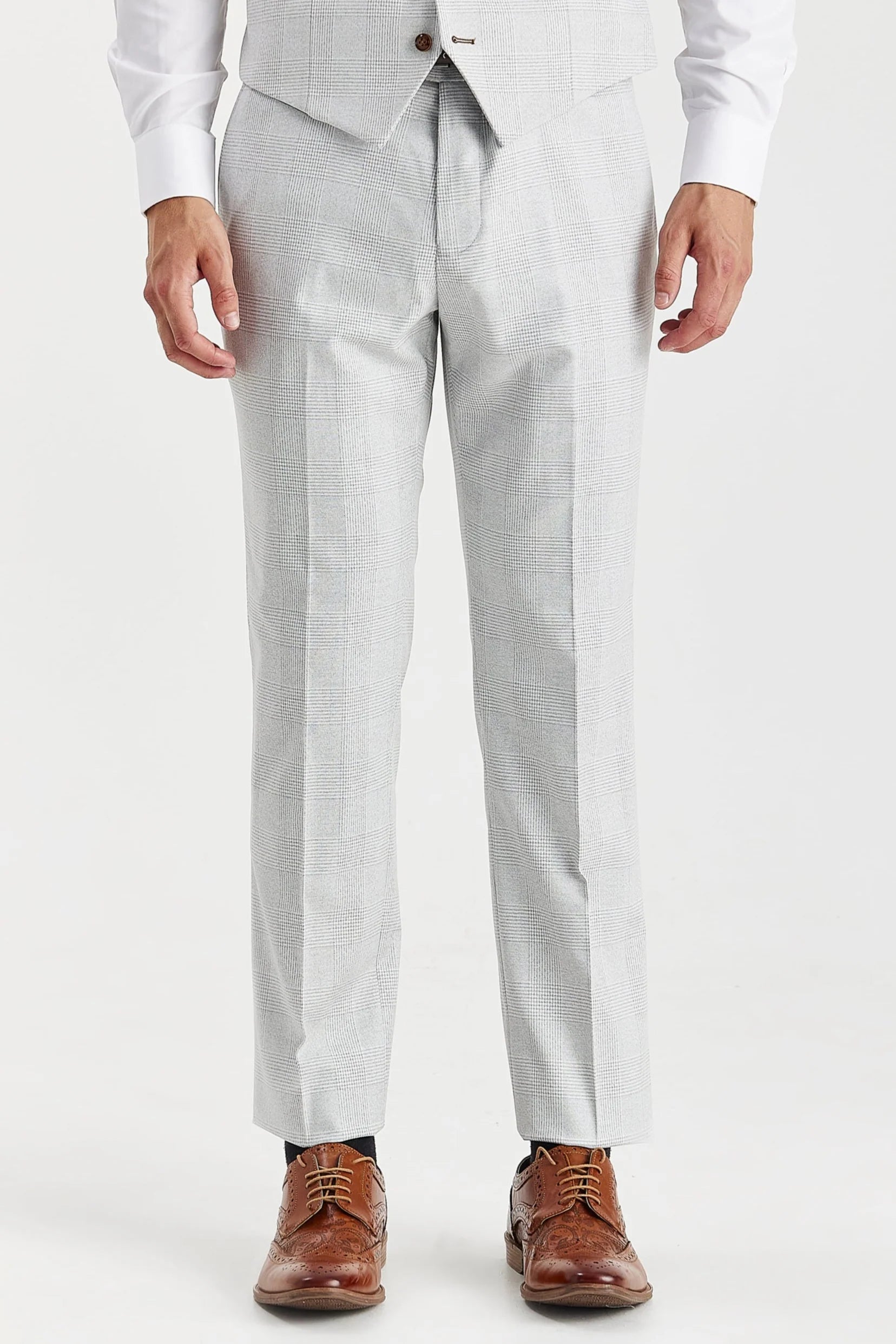 Front view of stone glen check trousers worn with a matching waistcoat and brown brogues