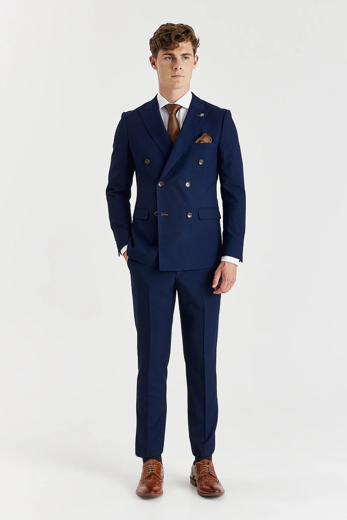 Full-length front view showing the jacket’s fitted shape and matching trousers with tapered legs.