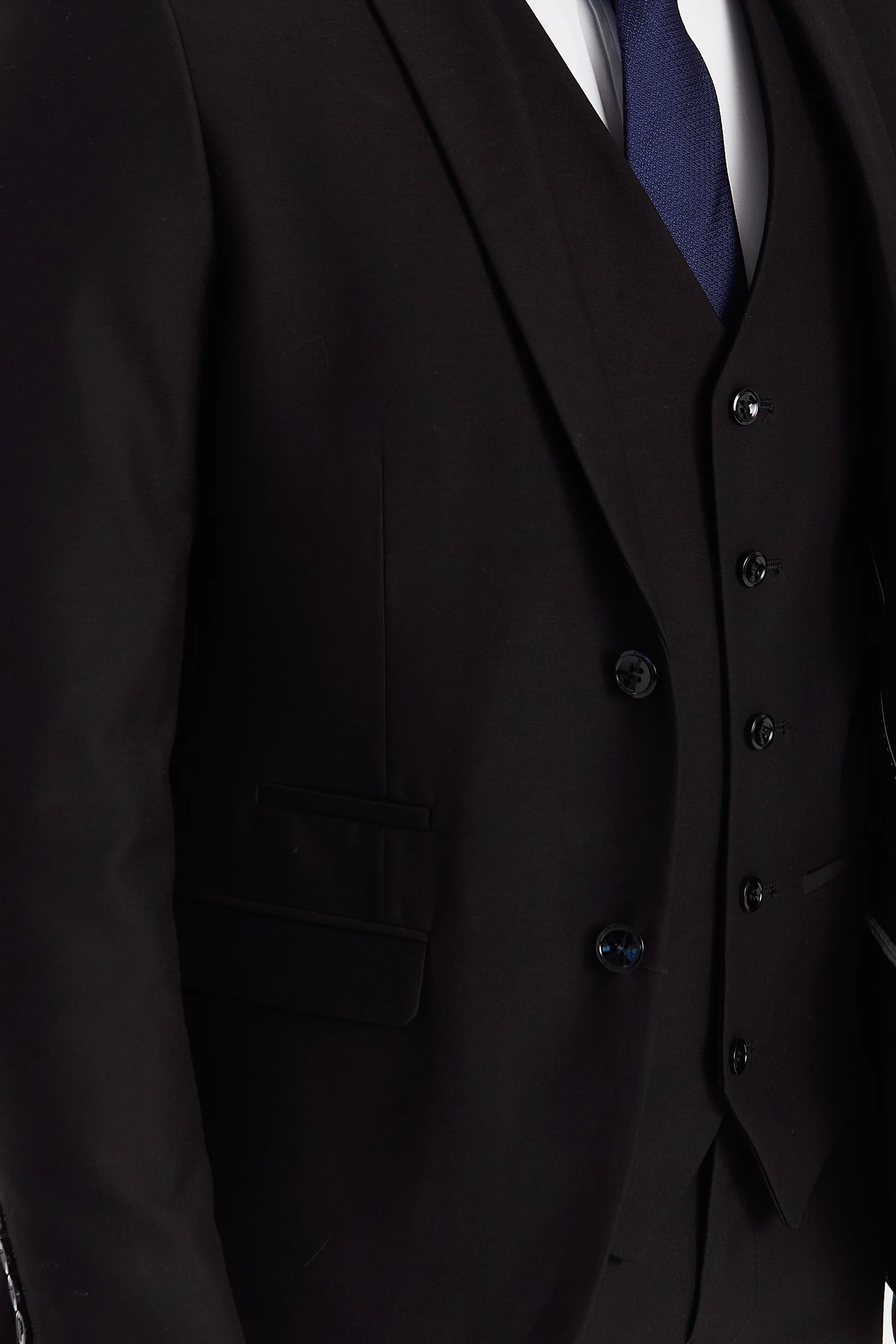 Close-up of the Parker Men's Black Blazer and matching waistcoat, highlighting the smooth black fabric, flap pocket detail, and matching black buttons.